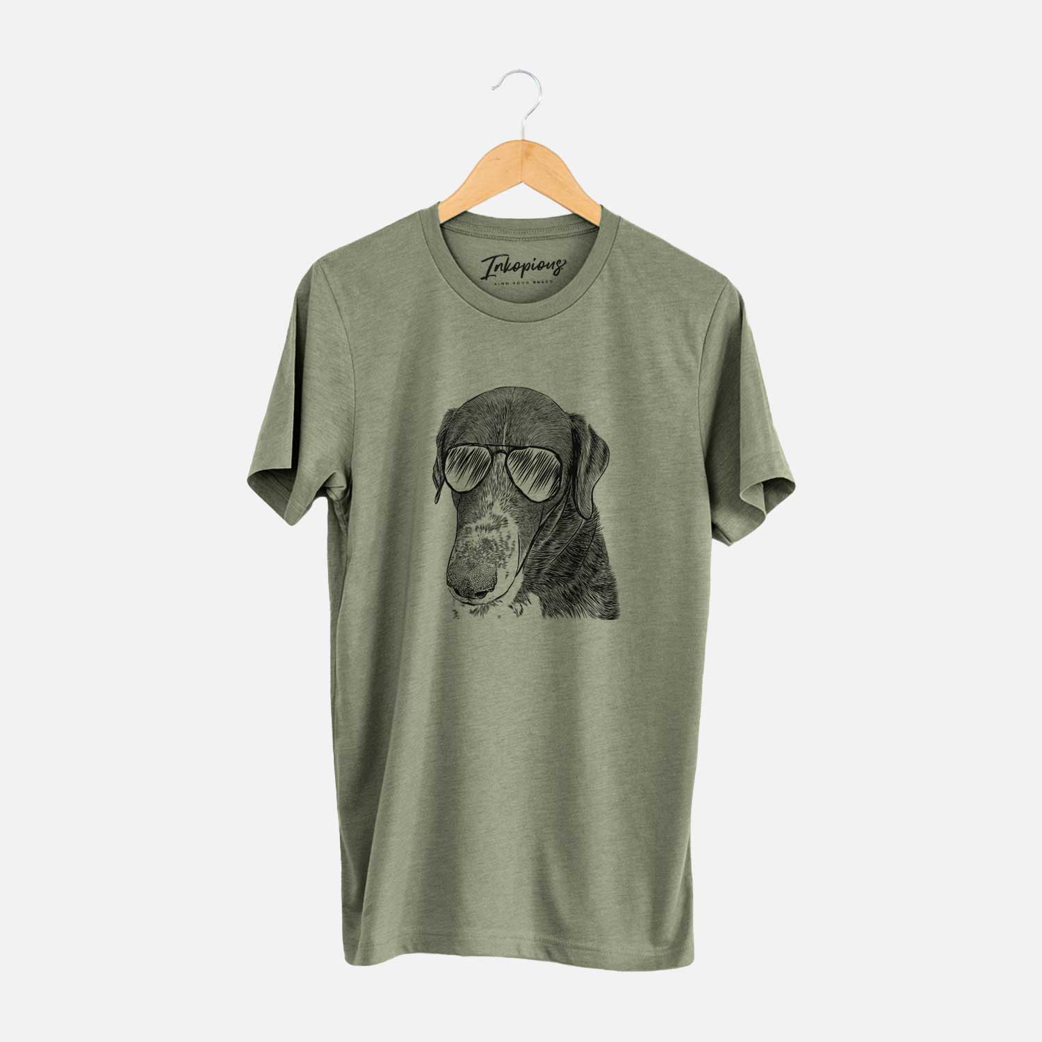 Hand-drawn sketch of Angel Orion the Mixed Breed wearing aviator sunglasses on an Olive Unisex crewneck