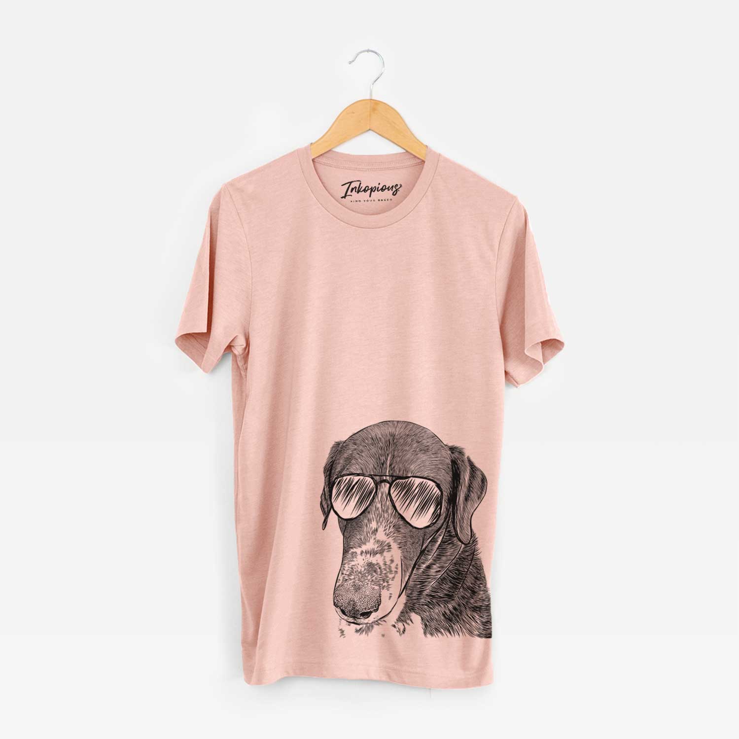 Hand-drawn sketch of Angel Orion the Mixed Breed wearing aviator sunglasses on a Peach Unisex crewneck