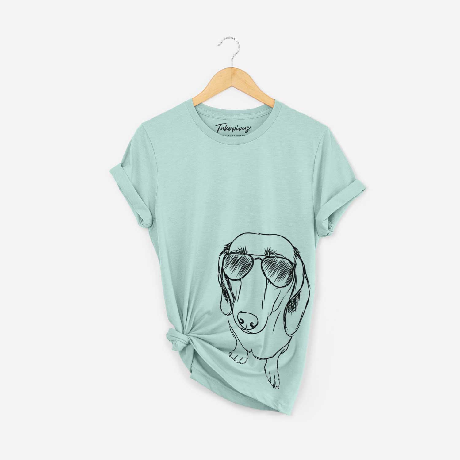 Hand-drawn sketch of Annabelle the Dachshund wearing aviator sunglasses on a Heather Sage Bella Canvas Unisex Crewneck