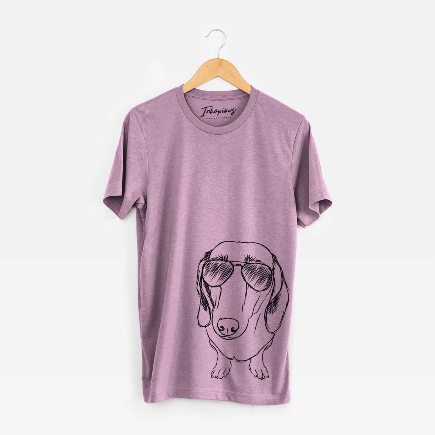 Hand-drawn sketch of Annabelle the Dachshund wearing aviator sunglasses on an Orchid Bella Canvas Unisex Crewneck