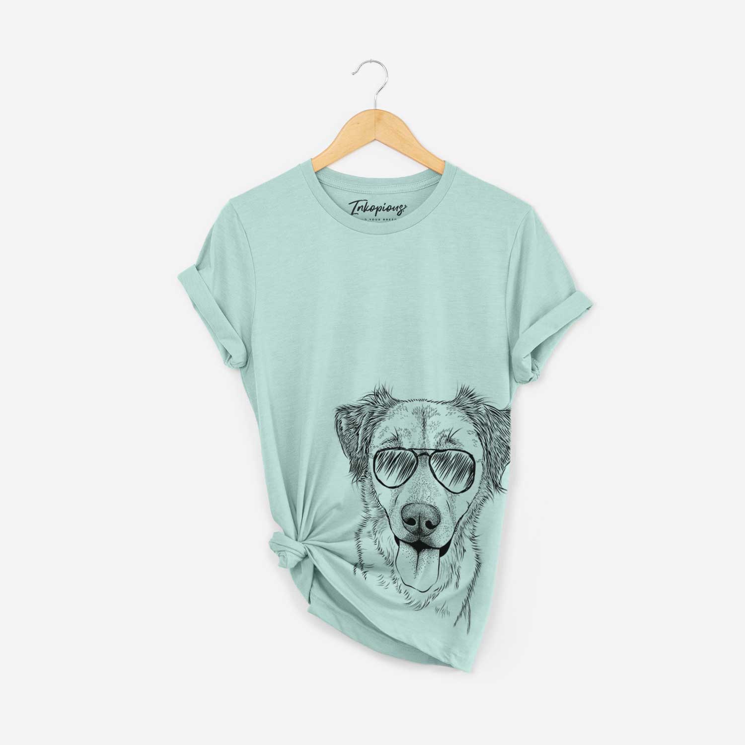 Hand-drawn sketch of Apollo the Mixed Breed wearing aviator sunglasses on a Heather Sage Bella Canvas Unisex Crewneck