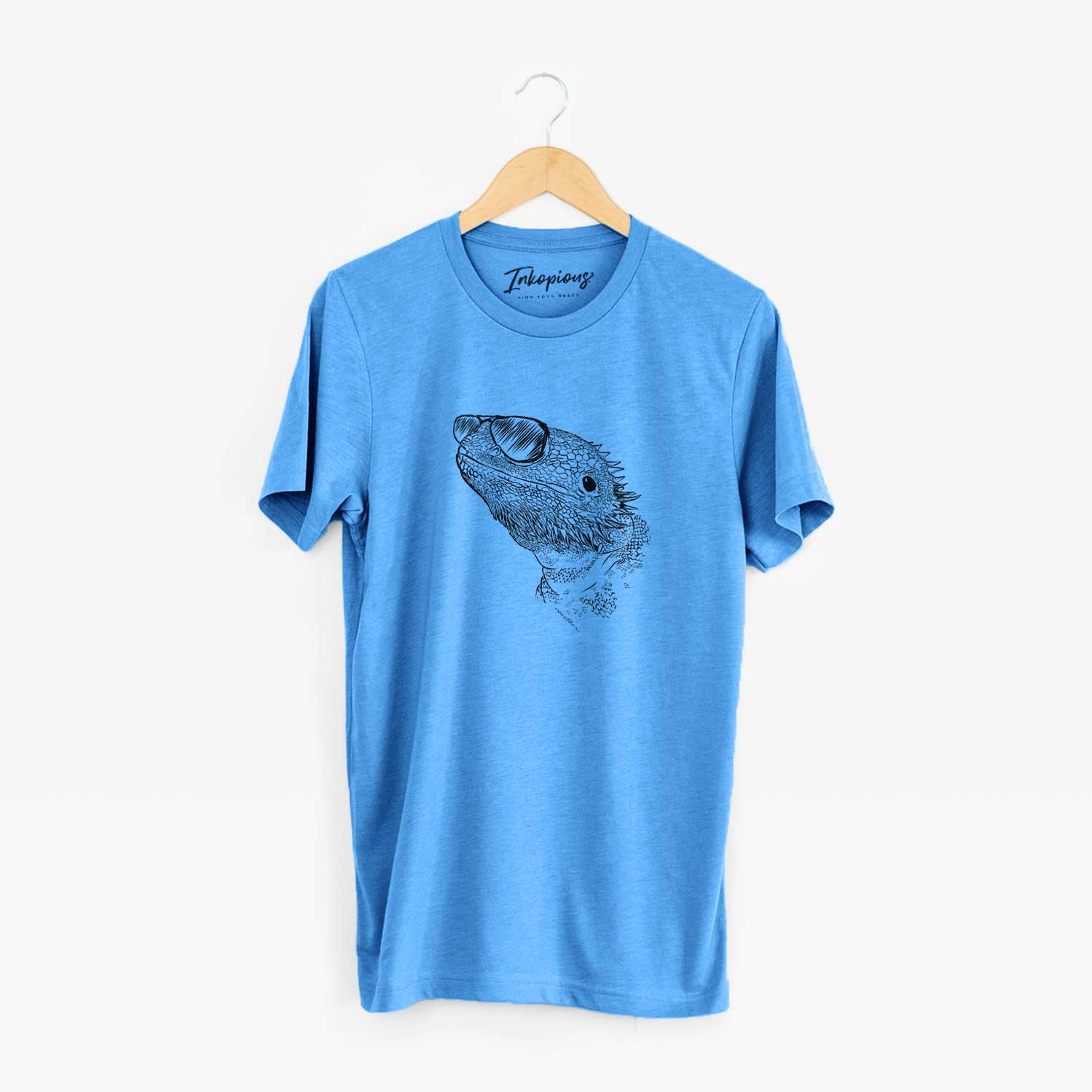 Hand-drawn sketch of Ash the Bearded Dragon wearing aviator sunglasses on a Blue Unisex crewneck