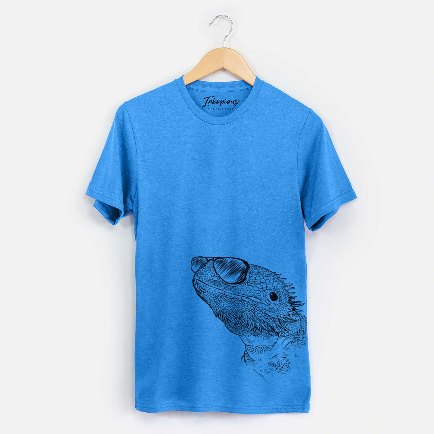 Hand-drawn sketch of Ash the Bearded Dragon wearing aviator sunglasses on a Blue Unisex crewneck