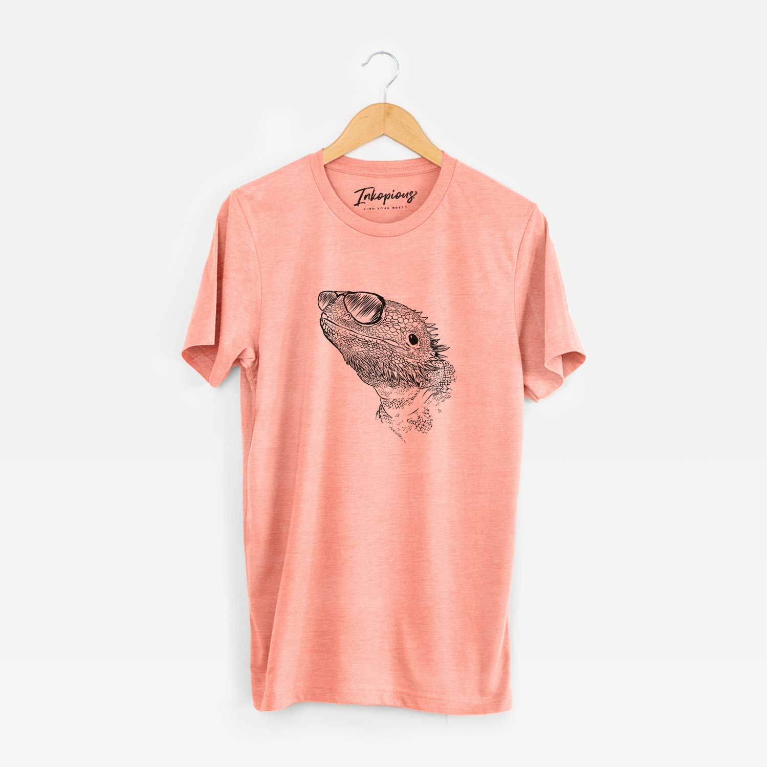 Hand-drawn sketch of Ash the Bearded Dragon wearing aviator sunglasses on a Sunset Unisex crewneck