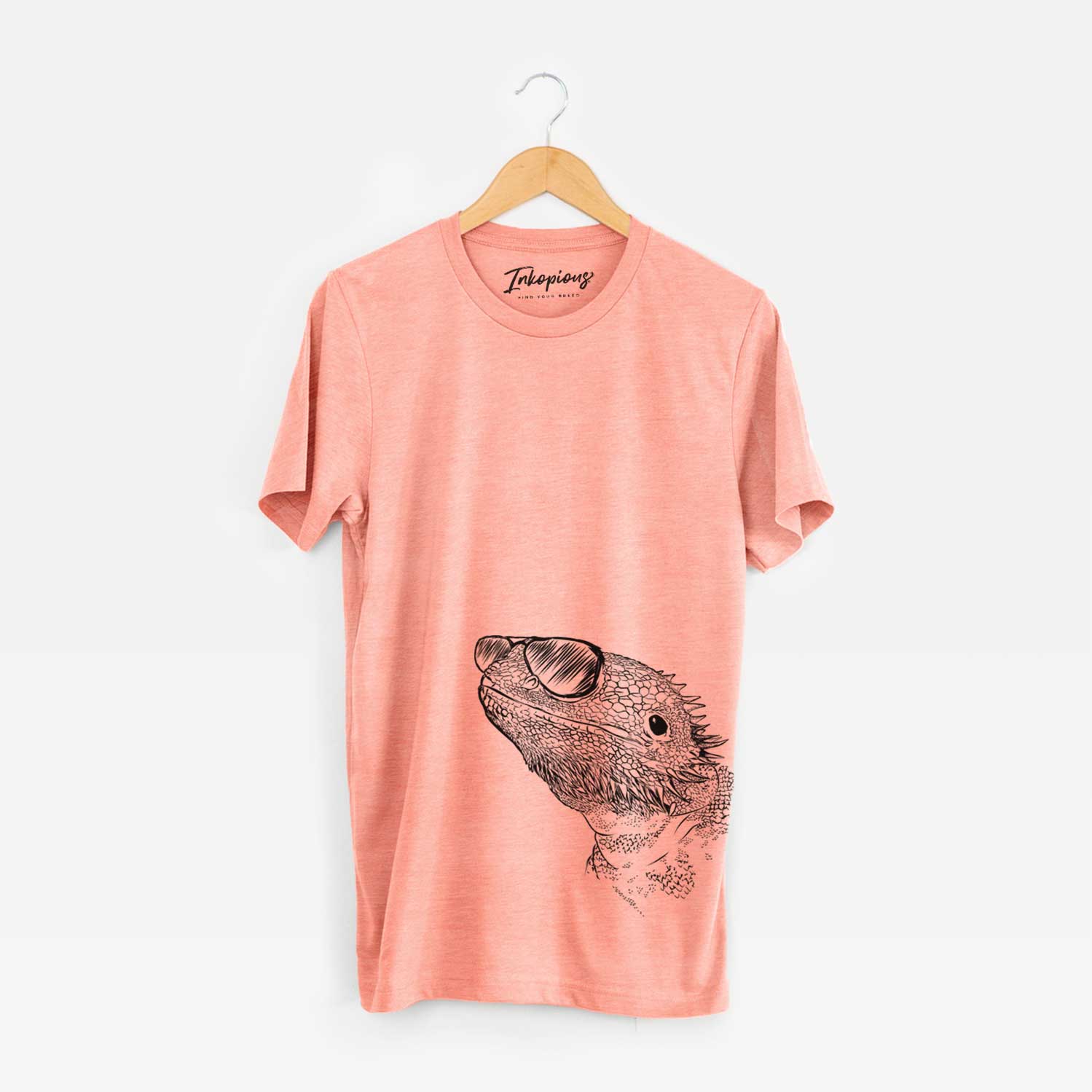 Hand-drawn sketch of Ash the Bearded Dragon wearing aviator sunglasses on a Sunset Unisex crewneck