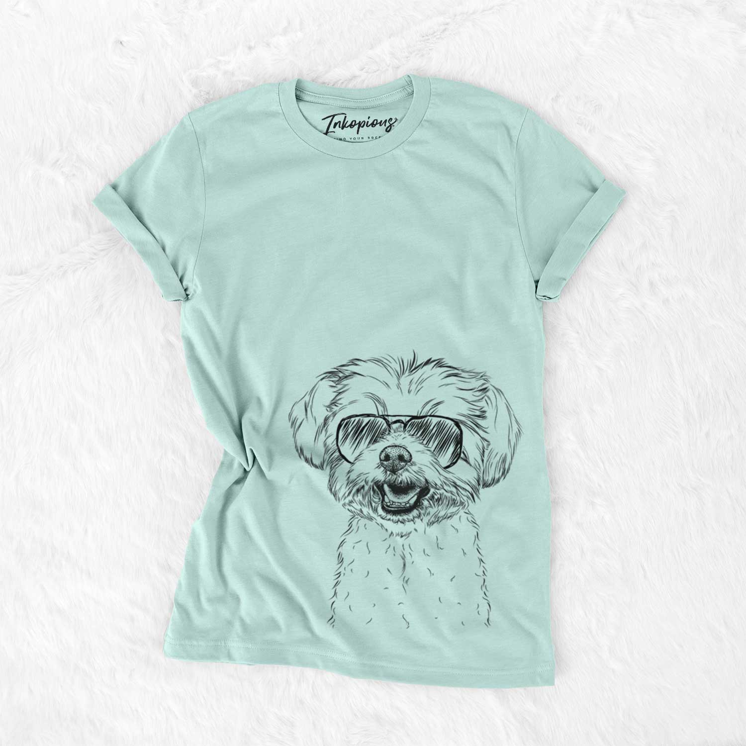 Hand-drawn sketch of Aspen the Morkie wearing aviator sunglasses on a Heather Sage Unisex crewneck