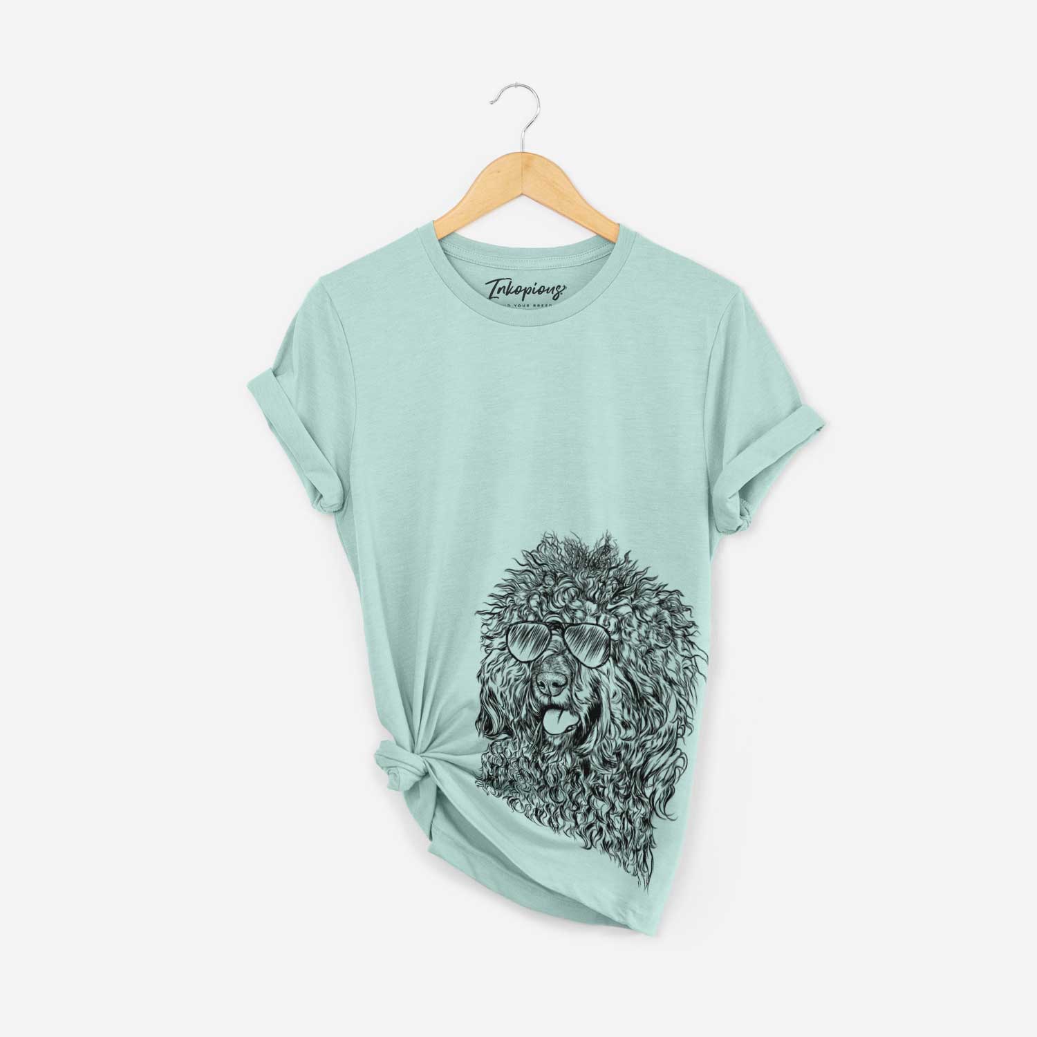 Hand-drawn sketch of Babs the Barbet wearing aviator sunglasses on a Heather Sage Bella Canvas Unisex Crewneck