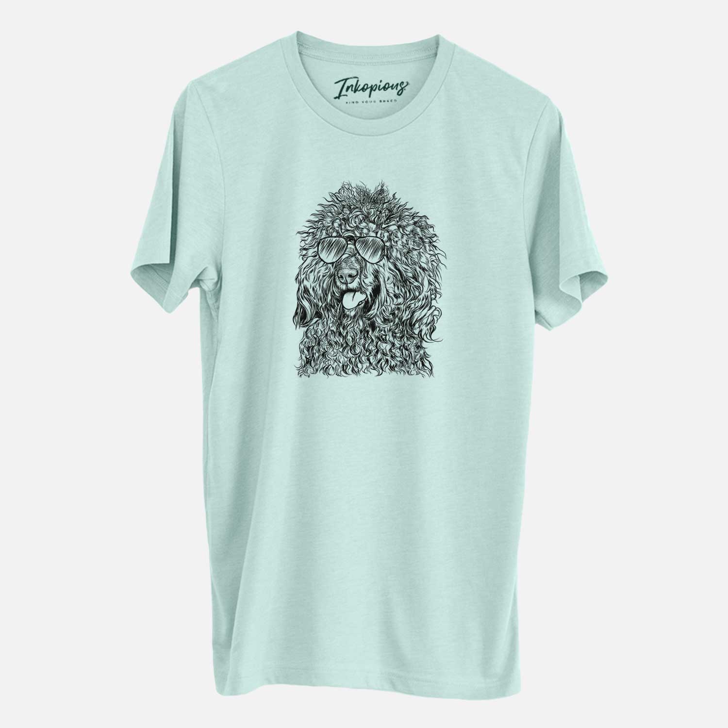 Hand-drawn sketch of Babs the Barbet wearing aviator sunglasses on a Heather Sage Unisex crewneck