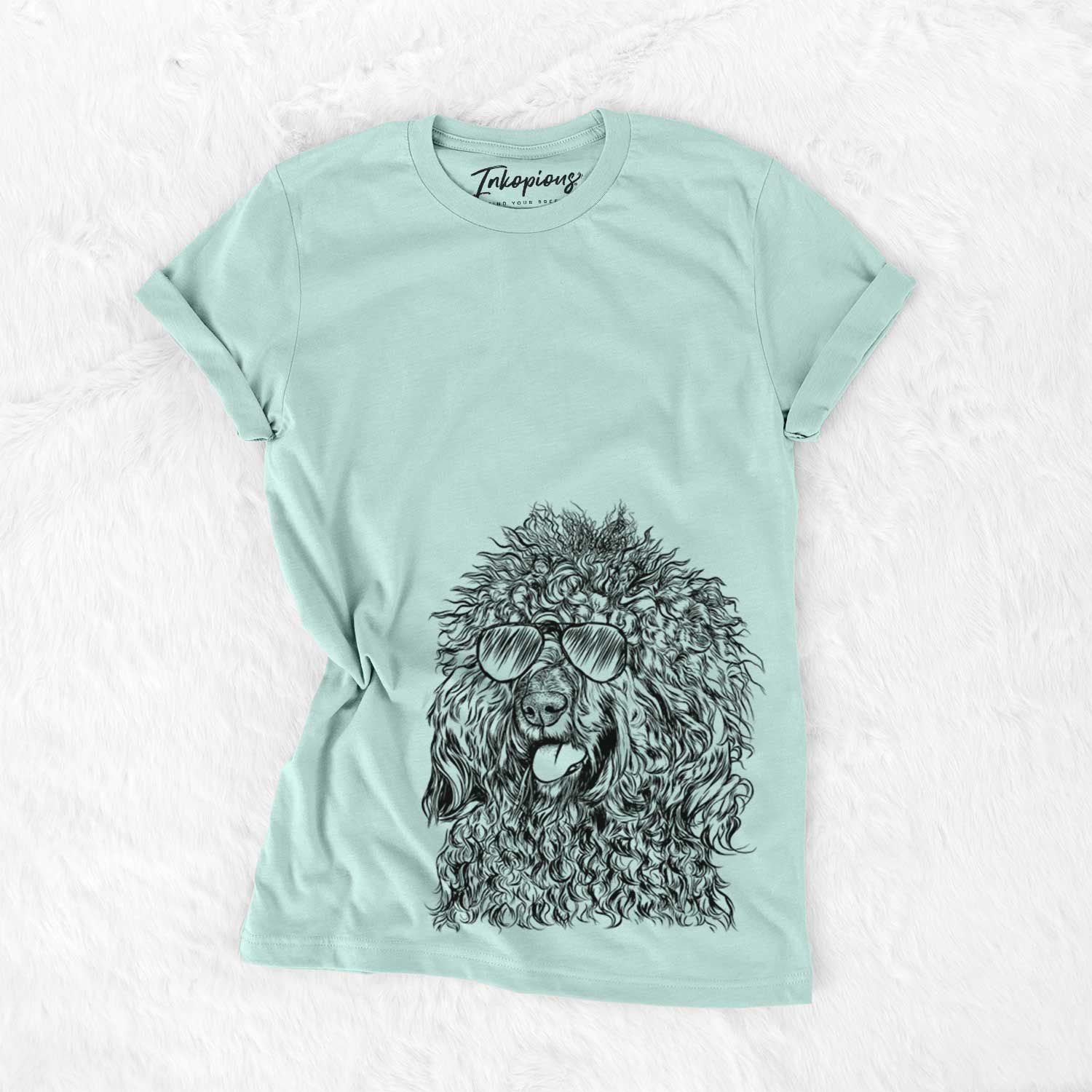 Hand-drawn sketch of Babs the Barbet wearing aviator sunglasses on a Heather Sage Unisex crewneck