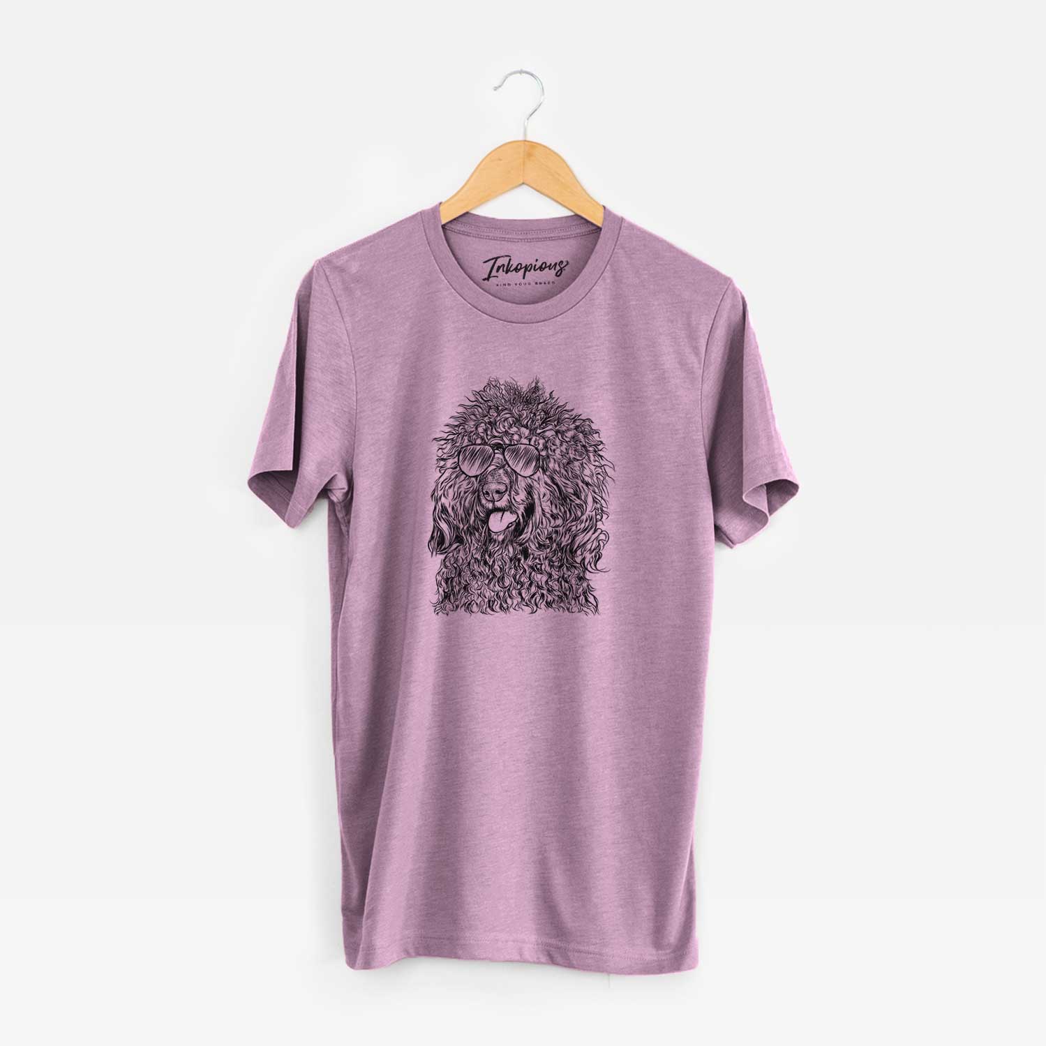 Hand-drawn sketch of Babs the Barbet wearing aviator sunglasses on an Orchid Unisex crewneck