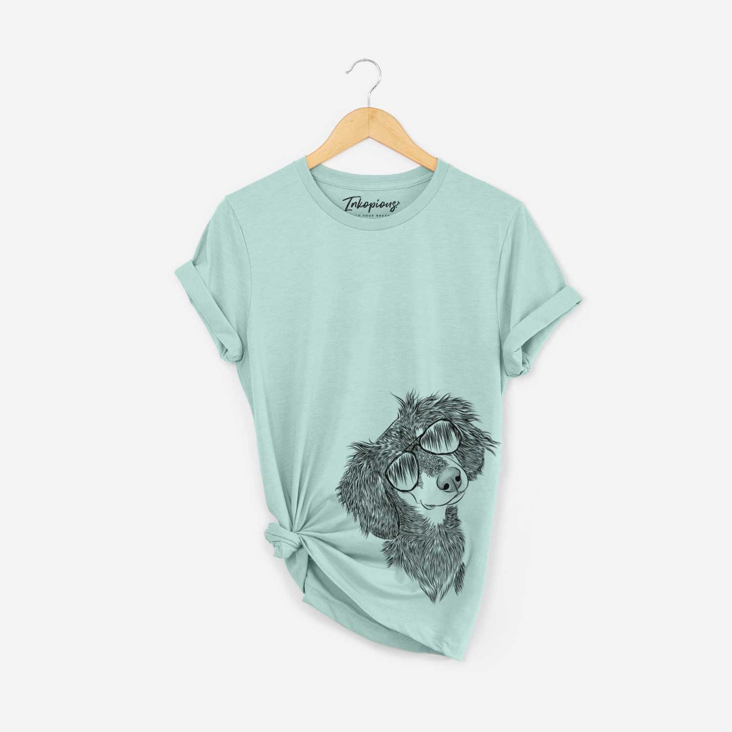 Hand-drawn sketch of Bailey the Long Haired Dachshund wearing aviator sunglasses on a Heather Sage Bella Canvas Unisex Crewneck