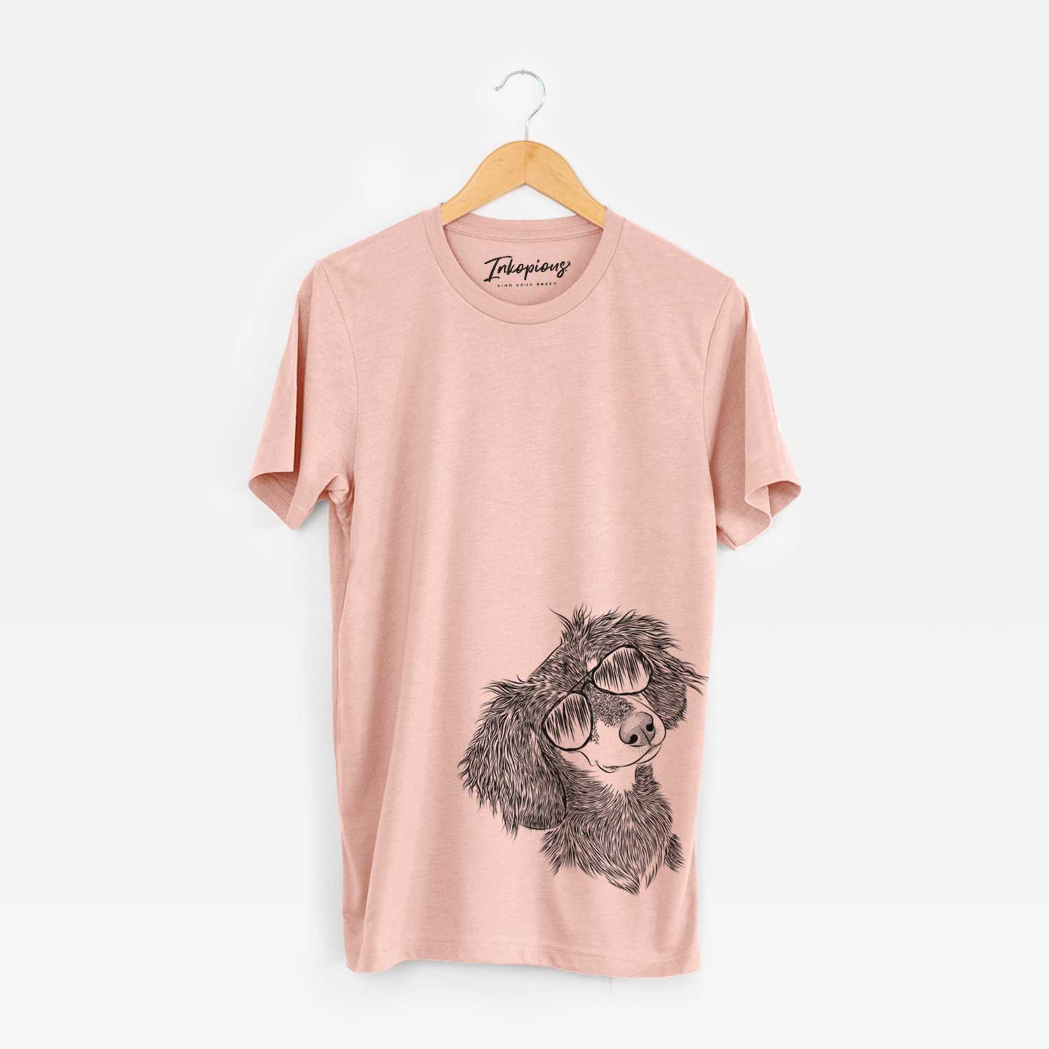 Hand-drawn sketch of Bailey the Long Haired Dachshund wearing aviator sunglasses on a Peach Bella Canvas Unisex Crewneck