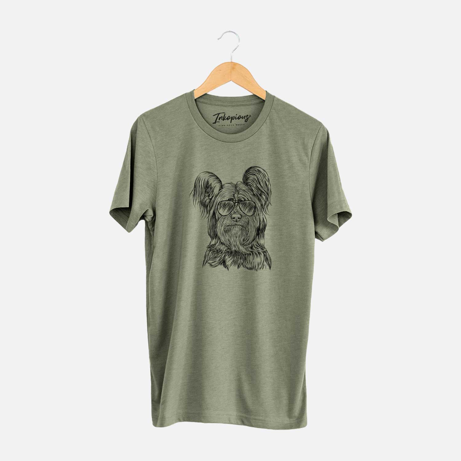 Hand-drawn sketch of Bandit the Skye Terrier wearing aviator sunglasses on an Olive Unisex crewneck