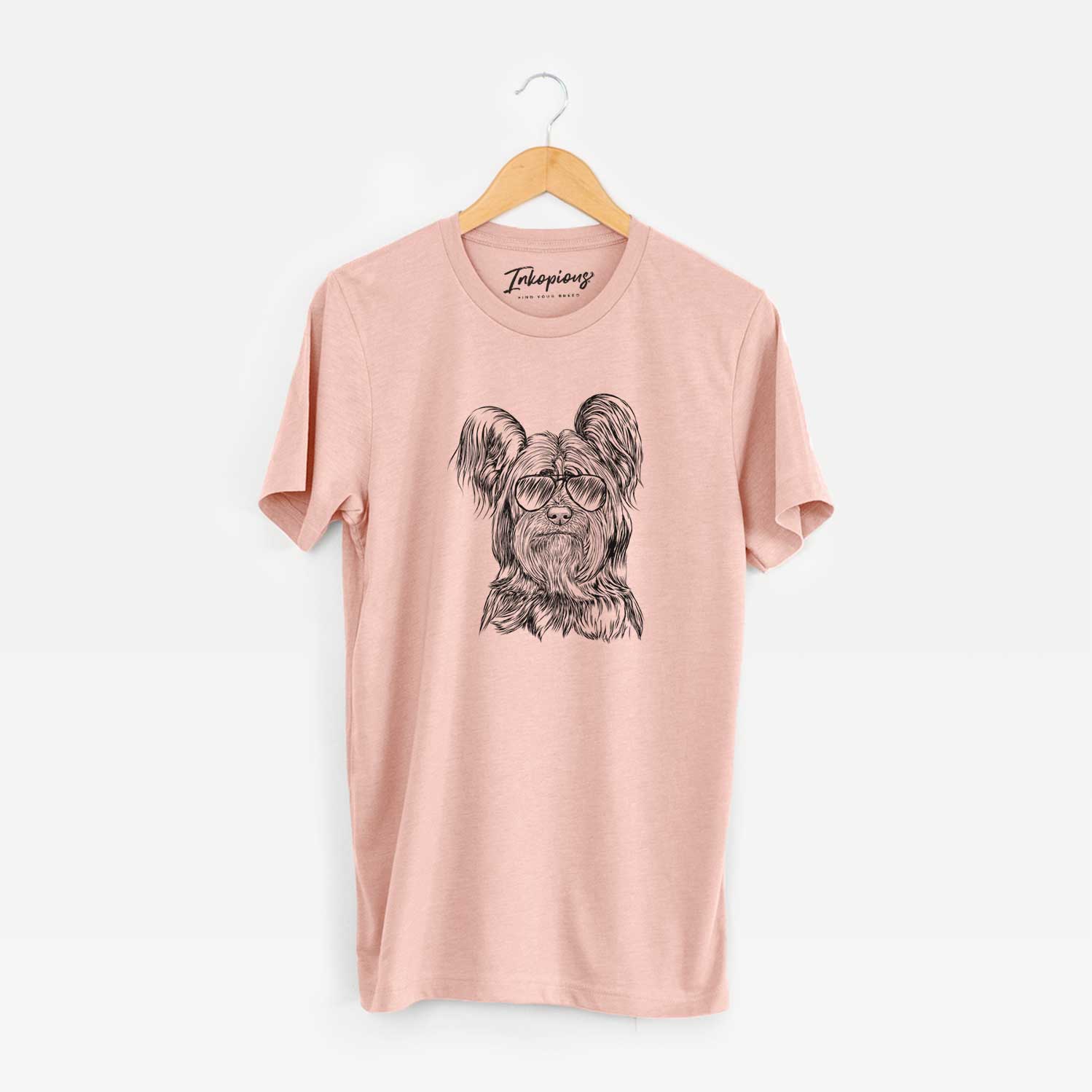 Hand-drawn sketch of Bandit the Skye Terrier wearing aviator sunglasses on a Peach Unisex crewneck