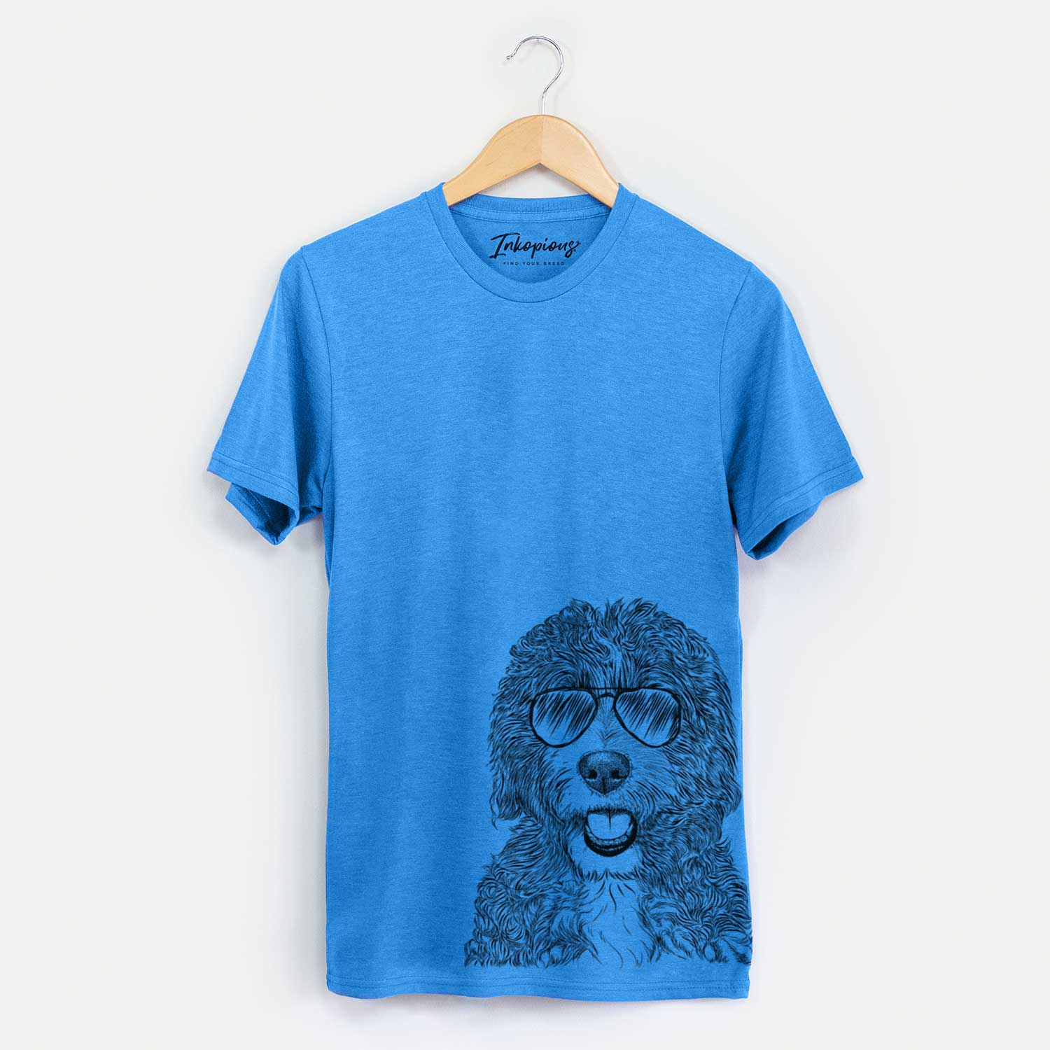 Hand-drawn sketch of Bash the Bernedoodle wearing aviator sunglasses on a Blue Unisex crewneck
