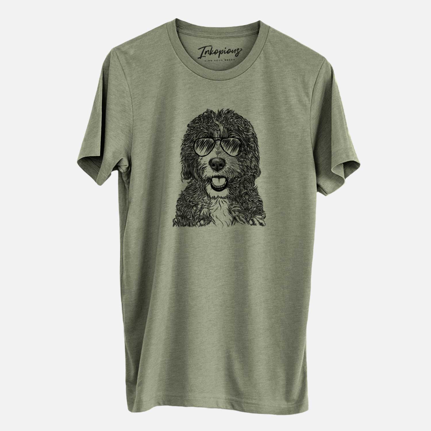 Hand-drawn sketch of Bash the Bernedoodle wearing aviator sunglasses on an Olive Unisex crewneck