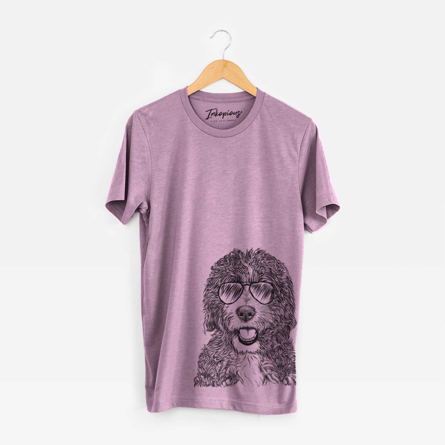 Hand-drawn sketch of Bash the Bernedoodle wearing aviator sunglasses on an Orchid Bella Canvas Unisex Crewneck