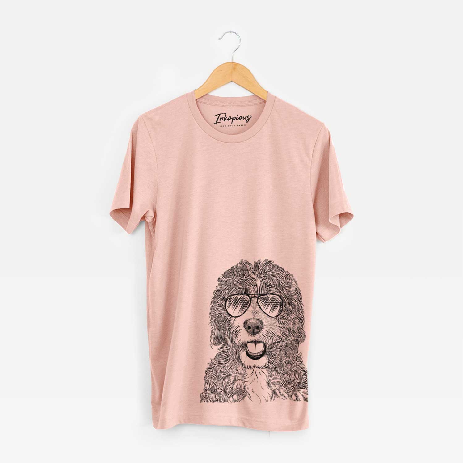 Hand-drawn sketch of Bash the Bernedoodle wearing aviator sunglasses on a Peach Unisex crewneck