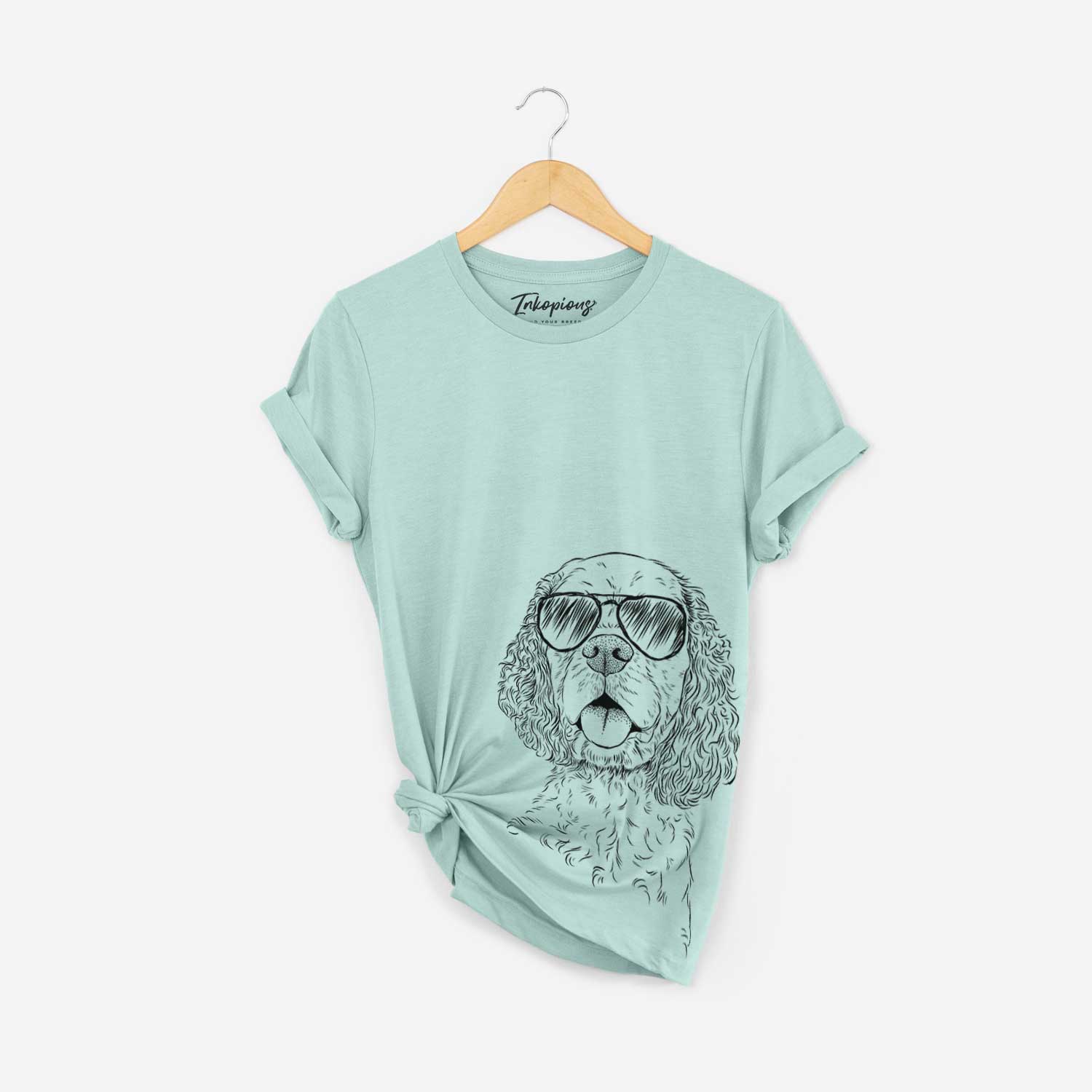 Hand-drawn sketch of Baxter the American Cocker Spaniel wearing aviator sunglasses on a Heather Sage Bella Canvas Unisex Crewneck