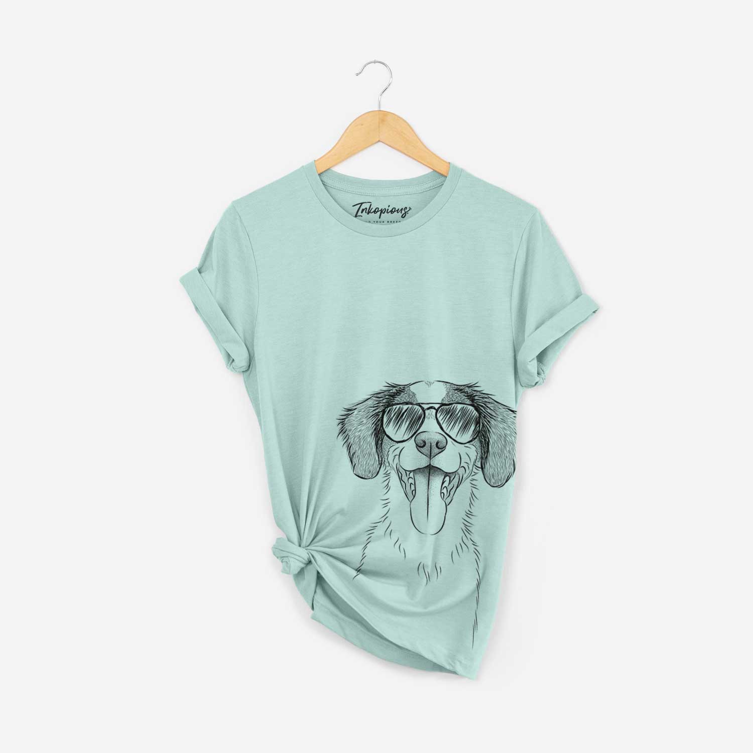 Hand-drawn sketch of Birdie the Brittany wearing aviator sunglasses on a Heather Sage Bella Canvas Unisex Crewneck