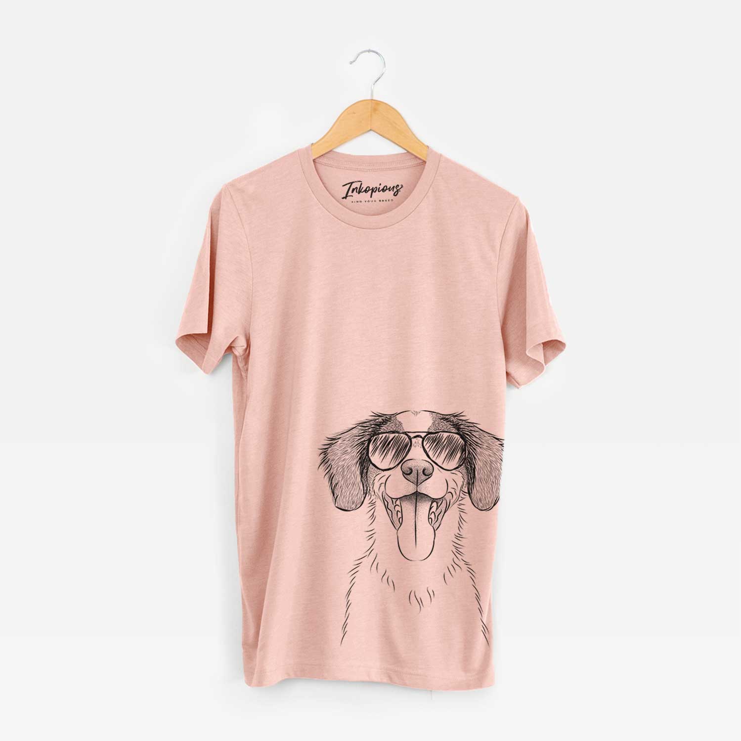 Hand-drawn sketch of Birdie the Brittany wearing aviator sunglasses on a Peach Bella Canvas Unisex Crewneck