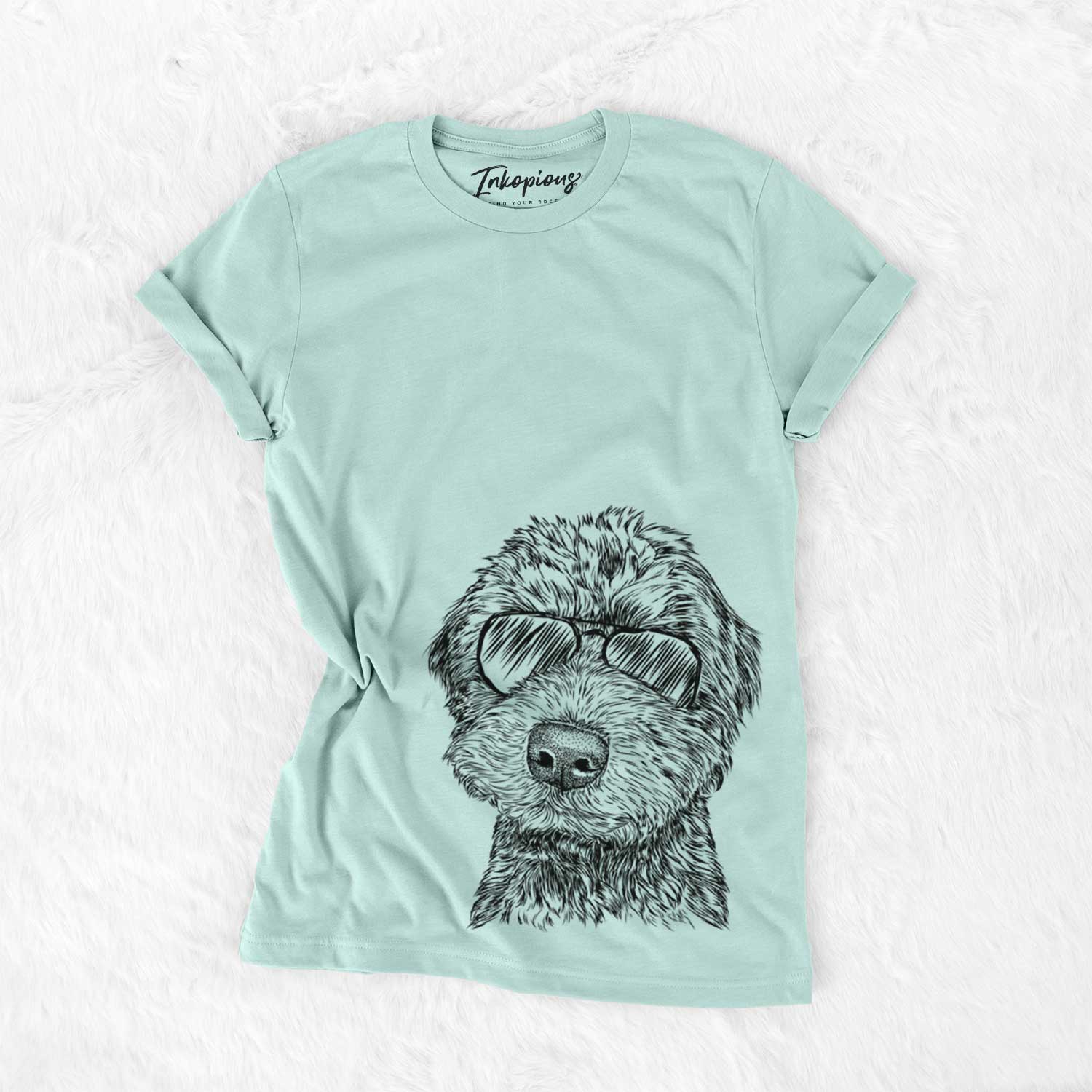 Hand-drawn sketch of Bowser the Whoodle wearing aviator sunglasses on a Heather Sage Unisex crewneck