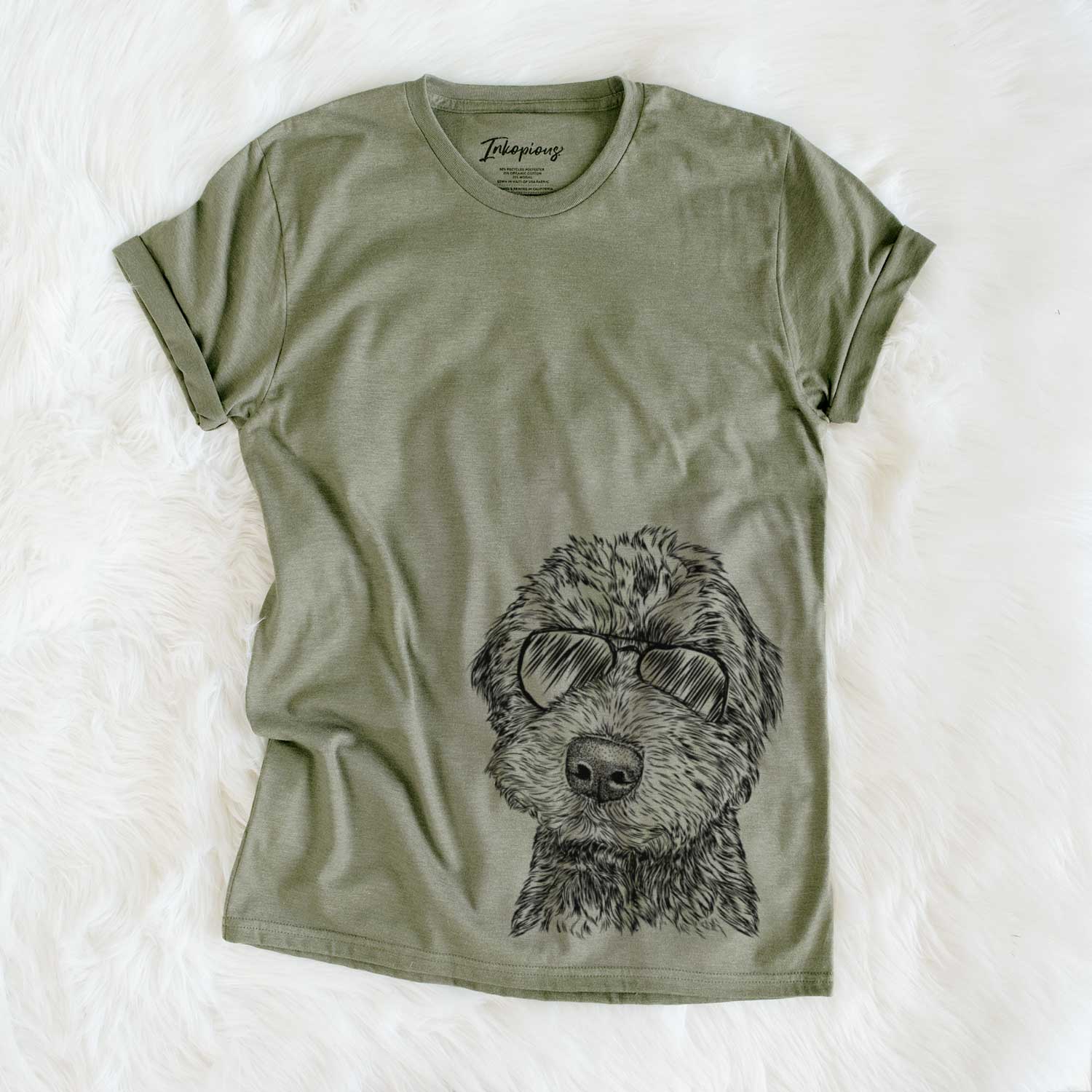 Hand-drawn sketch of Bowser the Whoodle wearing aviator sunglasses on an Olive Unisex crewneck