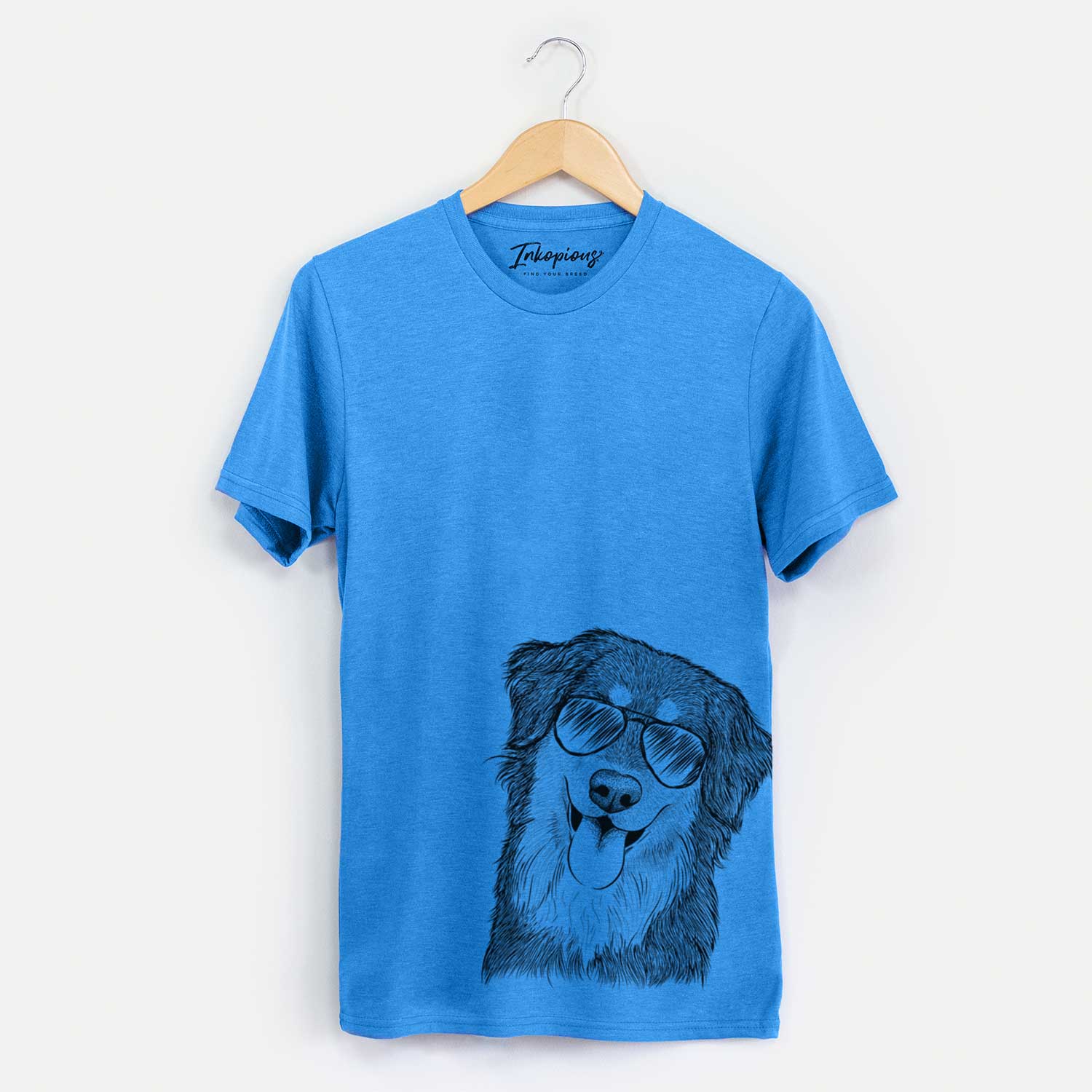 Hand-drawn sketch of Brodie the Golden Aussie wearing aviator sunglasses on a Blue Unisex crewneck