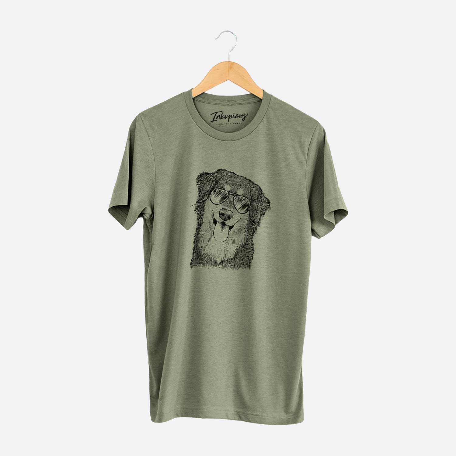 Hand-drawn sketch of Brodie the Golden Aussie wearing aviator sunglasses on an Olive Unisex crewneck