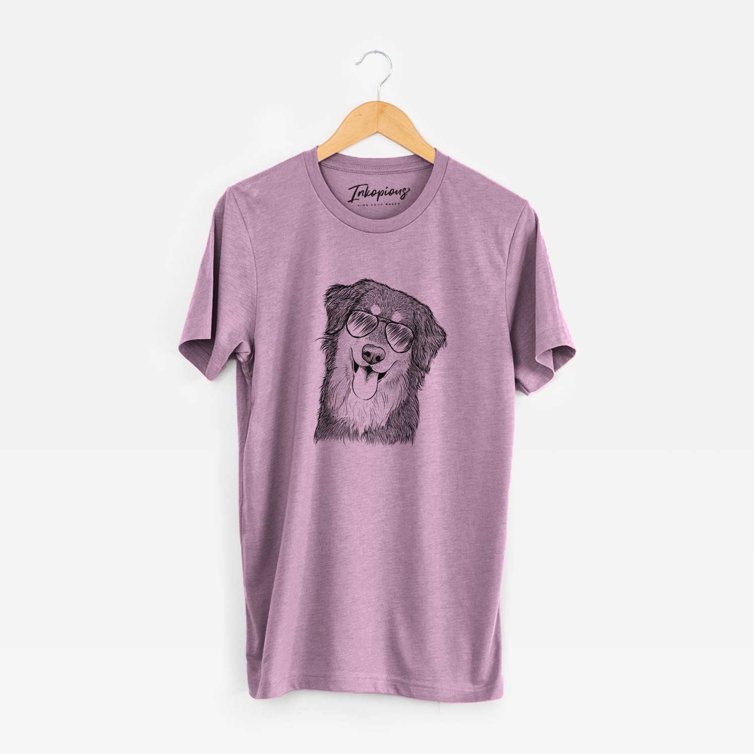 Hand-drawn sketch of Brodie the Golden Aussie wearing aviator sunglasses on an Orchid Unisex crewneck