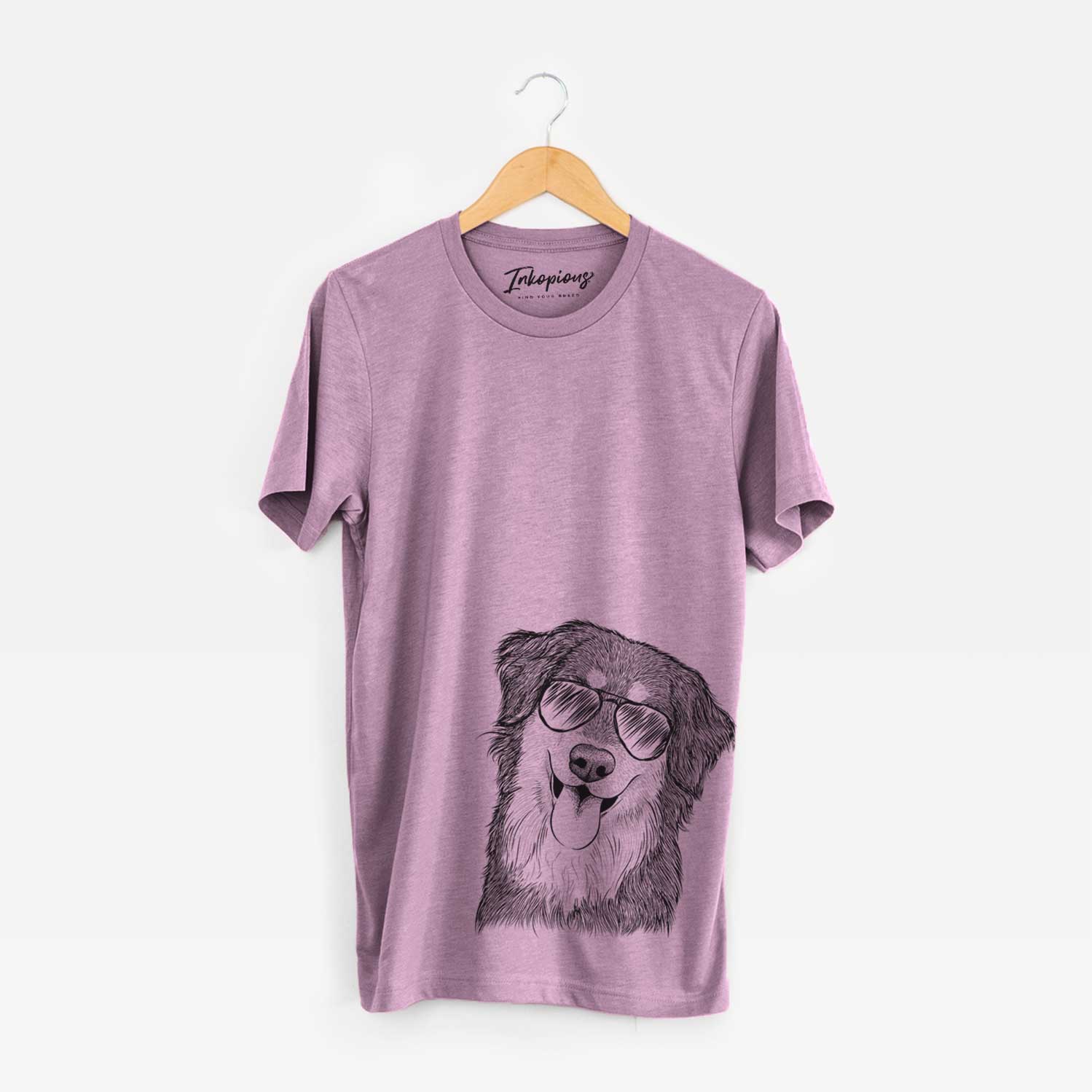 Hand-drawn sketch of Brodie the Golden Aussie wearing aviator sunglasses on an Orchid Unisex crewneck