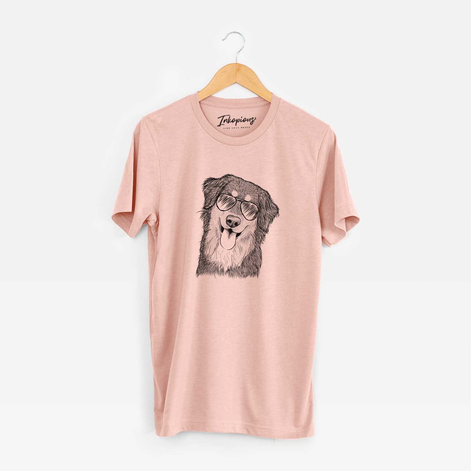 Hand-drawn sketch of Brodie the Golden Aussie wearing aviator sunglasses on a Peach Unisex crewneck