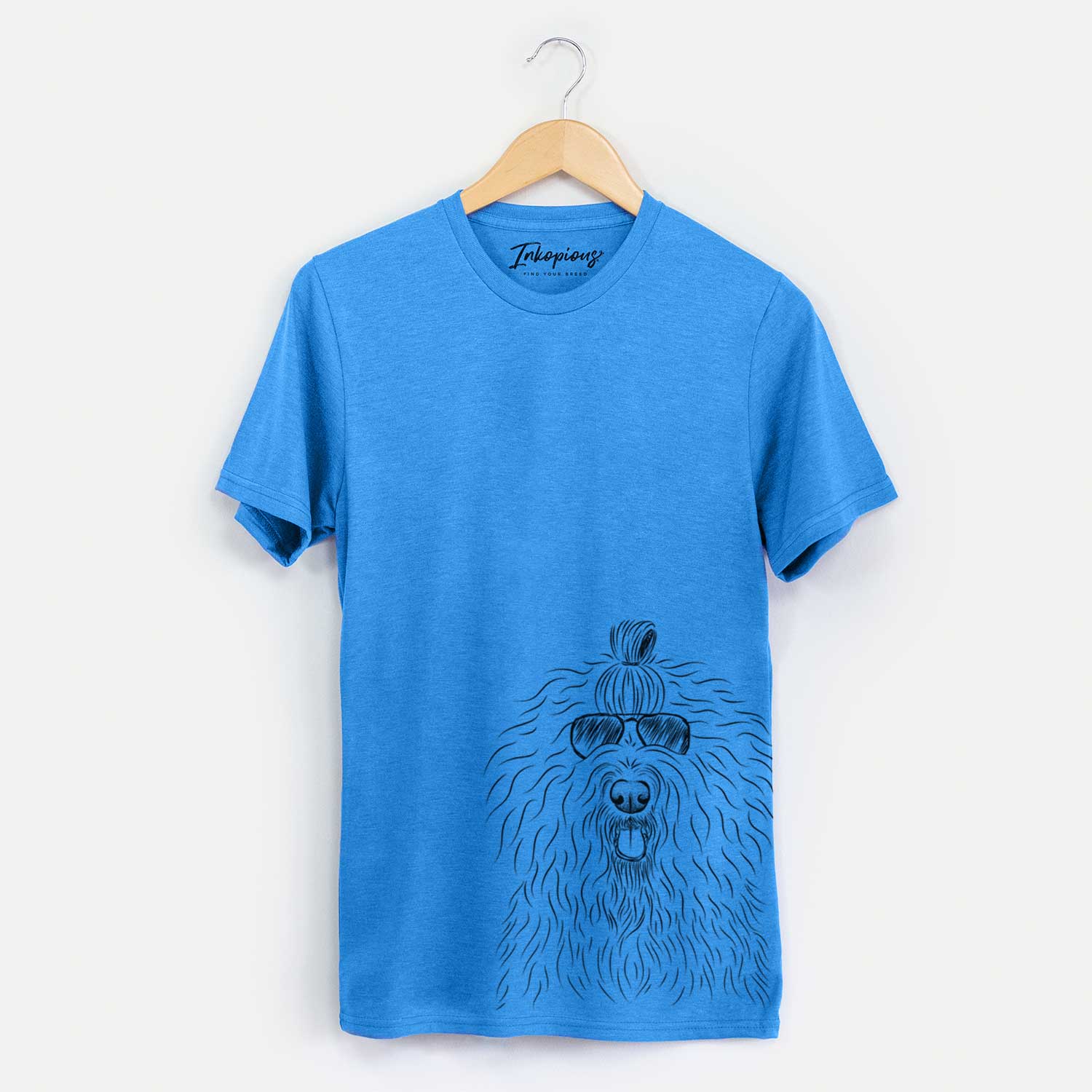 Hand-drawn sketch of Brody the Old English Sheepdog wearing aviator sunglasses on a Blue Unisex crewneck