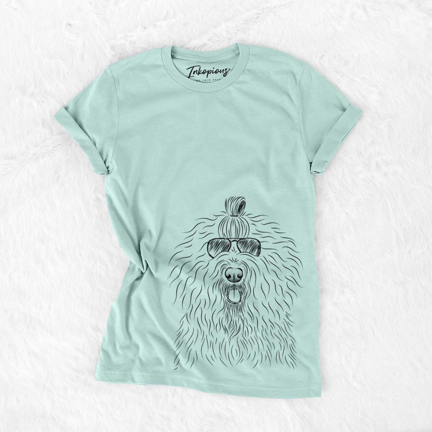 Hand-drawn sketch of Brody the Old English Sheepdog wearing aviator sunglasses on a Heather Sage Unisex crewneck