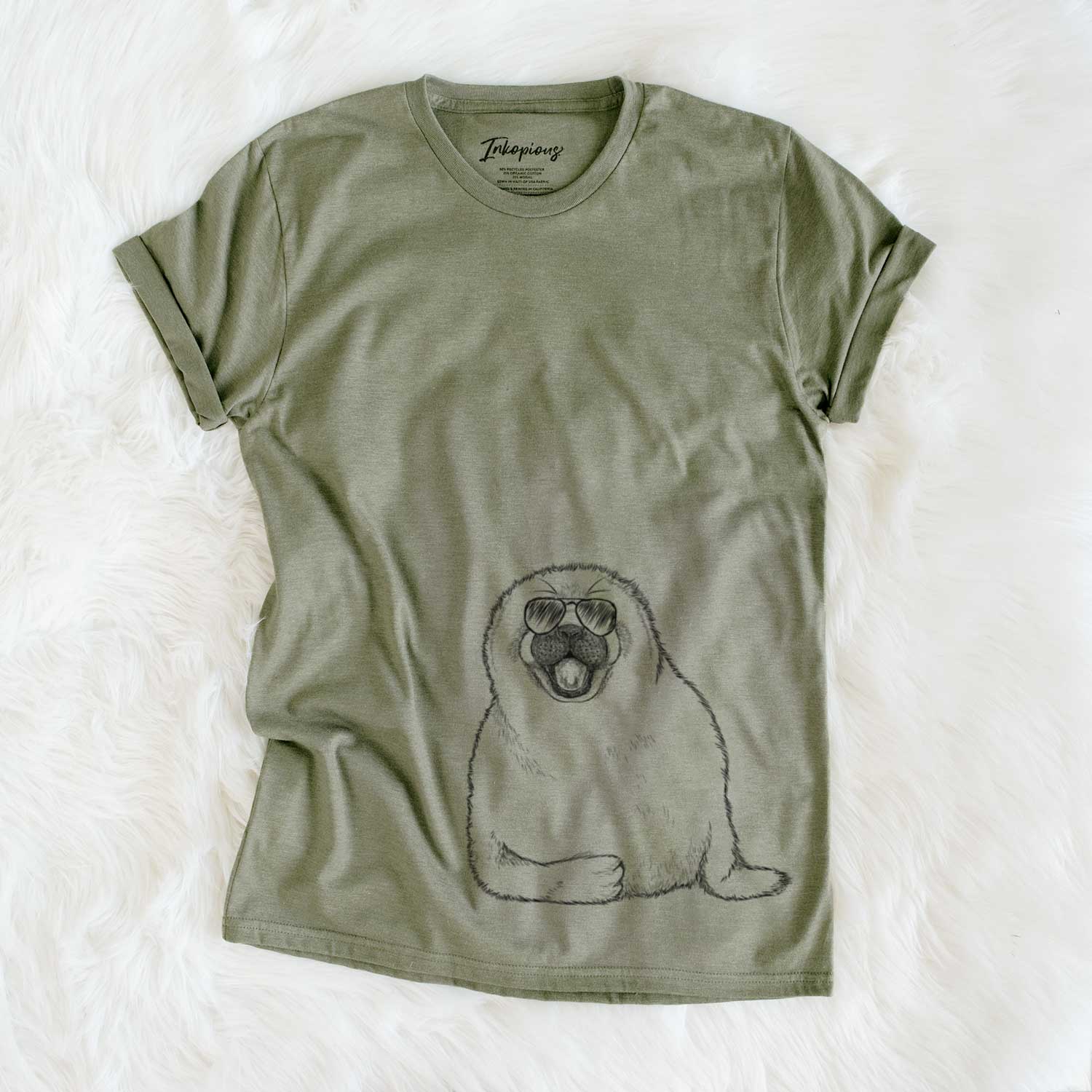 Hand-drawn sketch of Bub the Harp Seal wearing aviator sunglasses on an Olive Unisex crewneck