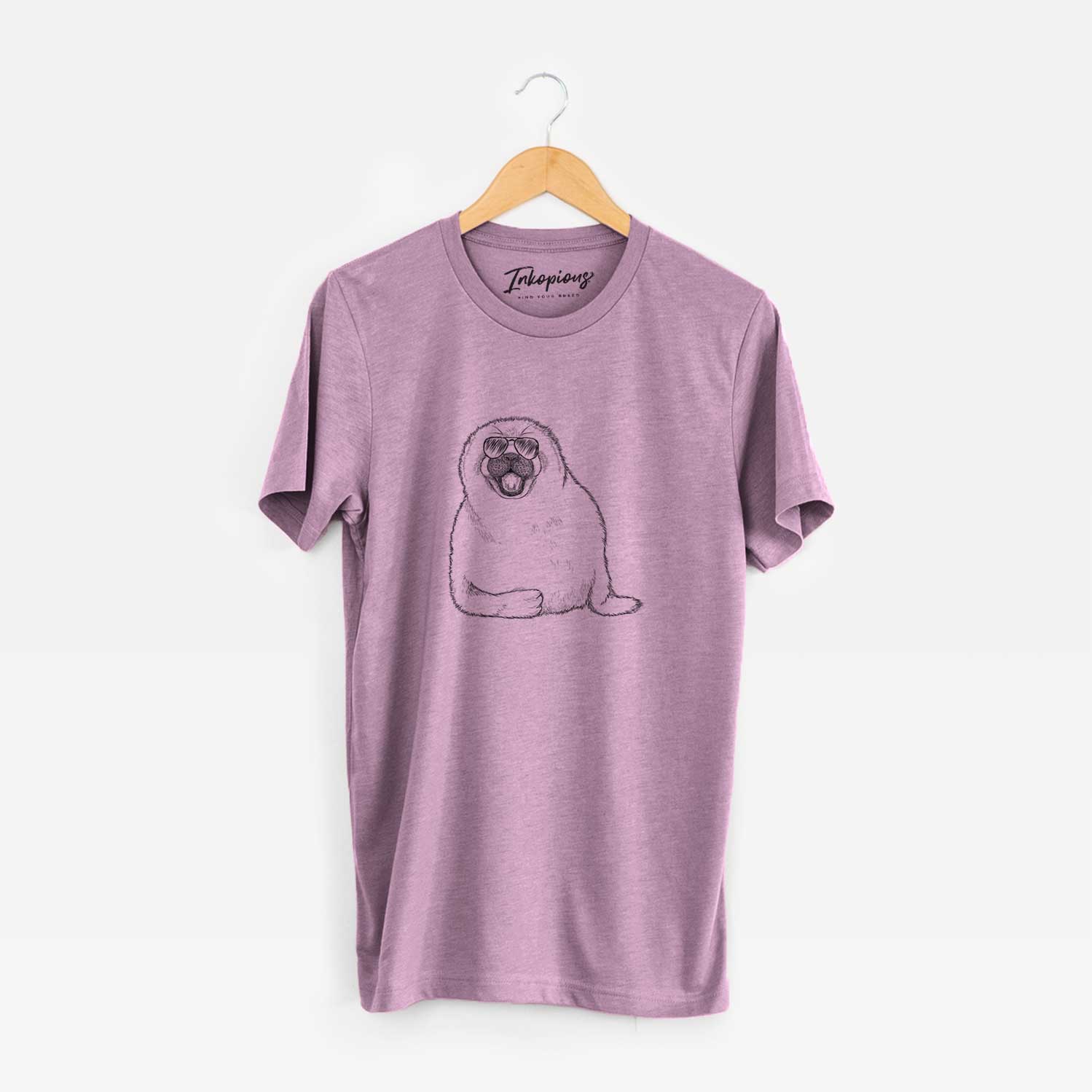 Hand-drawn sketch of Bub the Harp Seal wearing aviator sunglasses on an Orchid Unisex crewneck