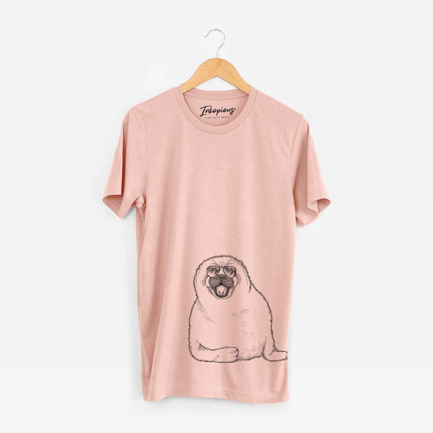 Hand-drawn sketch of Bub the Harp Seal wearing aviator sunglasses on a Peach Unisex crewneck