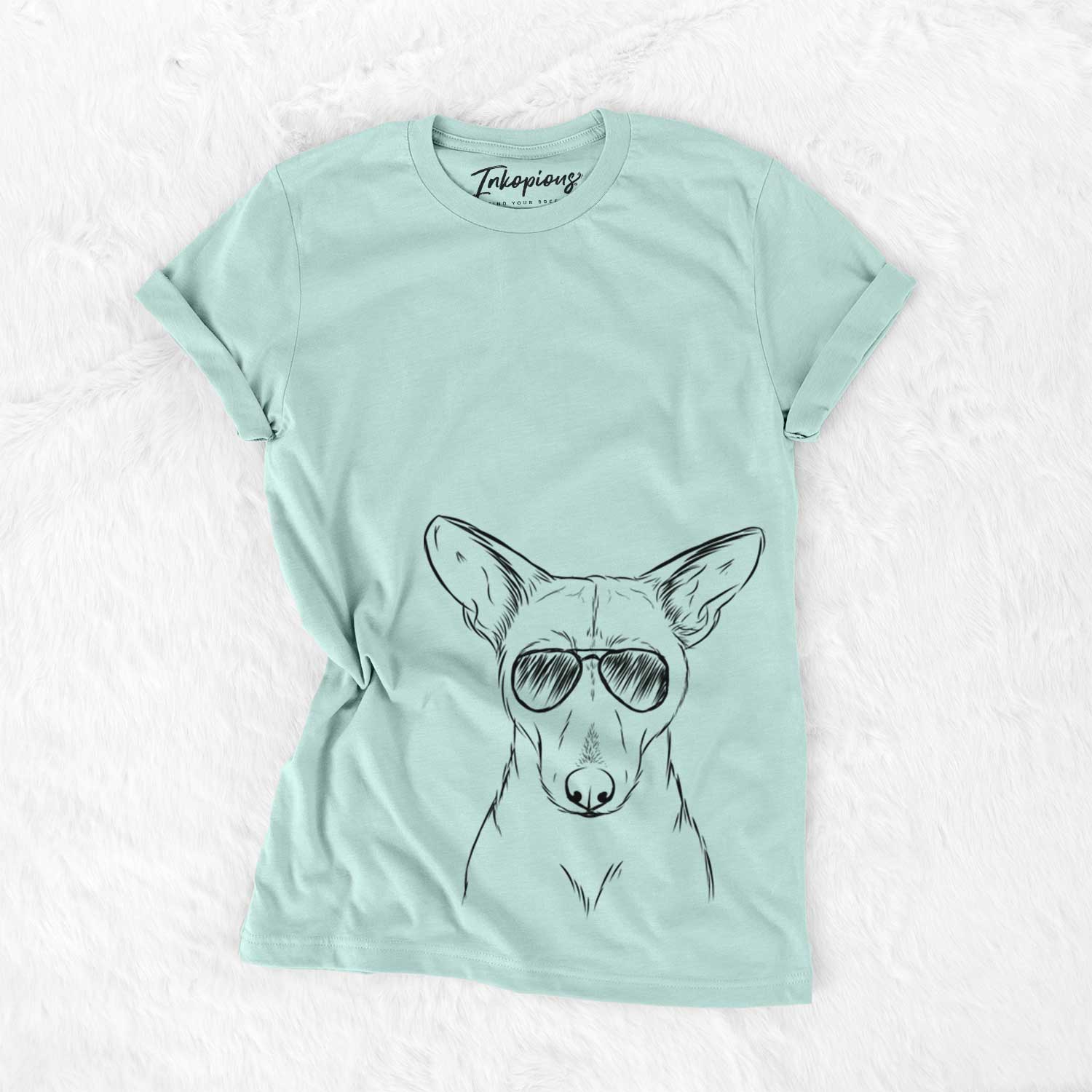 Hand-drawn sketch of Buff the Dorgi wearing aviator sunglasses on a Heather Sage Unisex crewneck