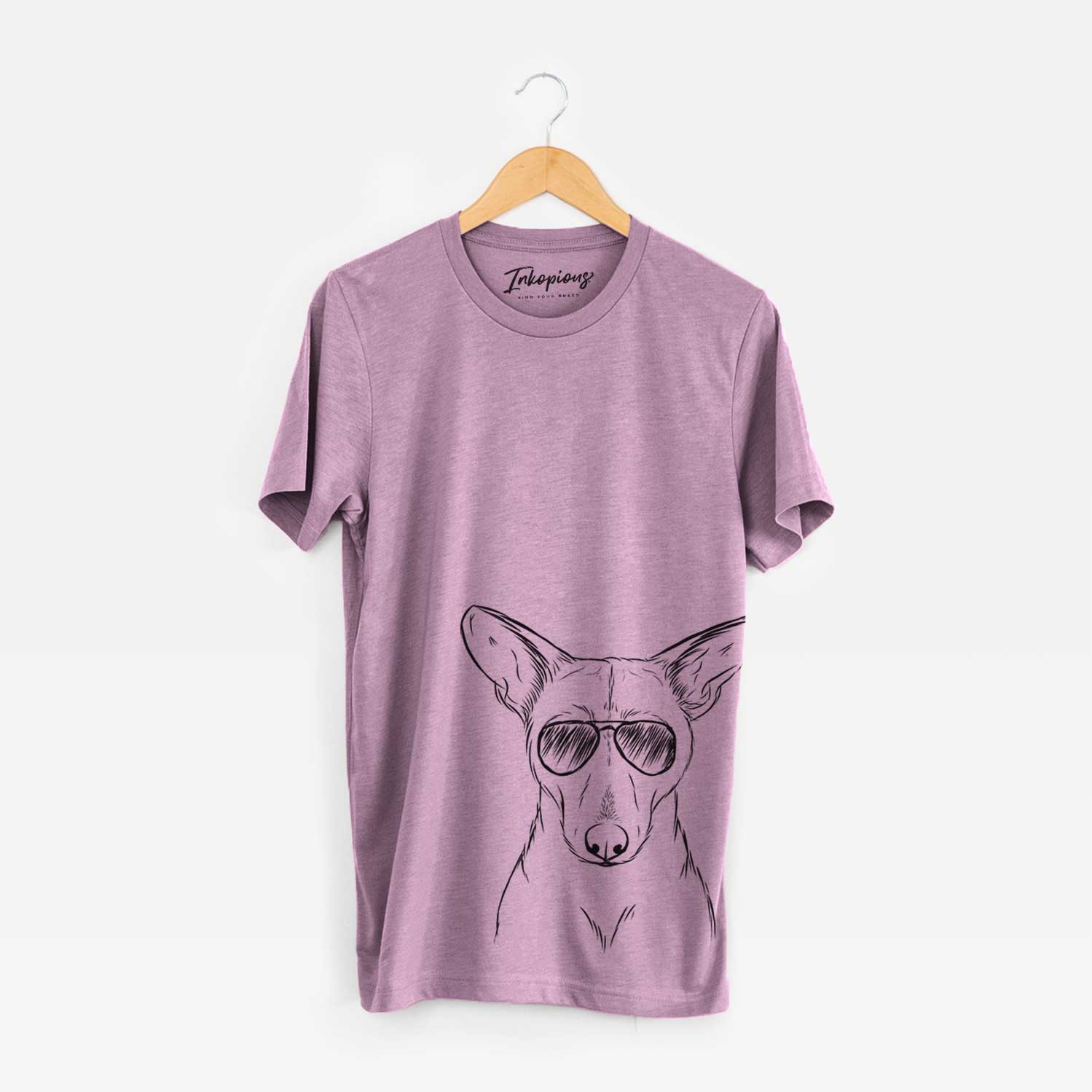 Hand-drawn sketch of Buff the Dorgi wearing aviator sunglasses on an Orchid Bella Canvas Unisex Crewneck
