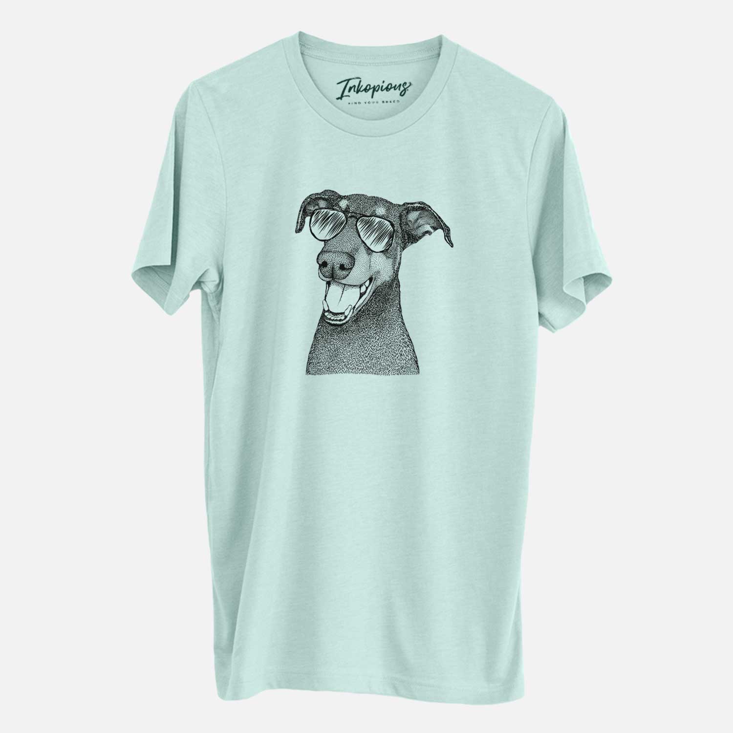 Hand-drawn sketch of Bunnie the Doberman Pinscher wearing aviator sunglasses on a Heather Sage Unisex crewneck