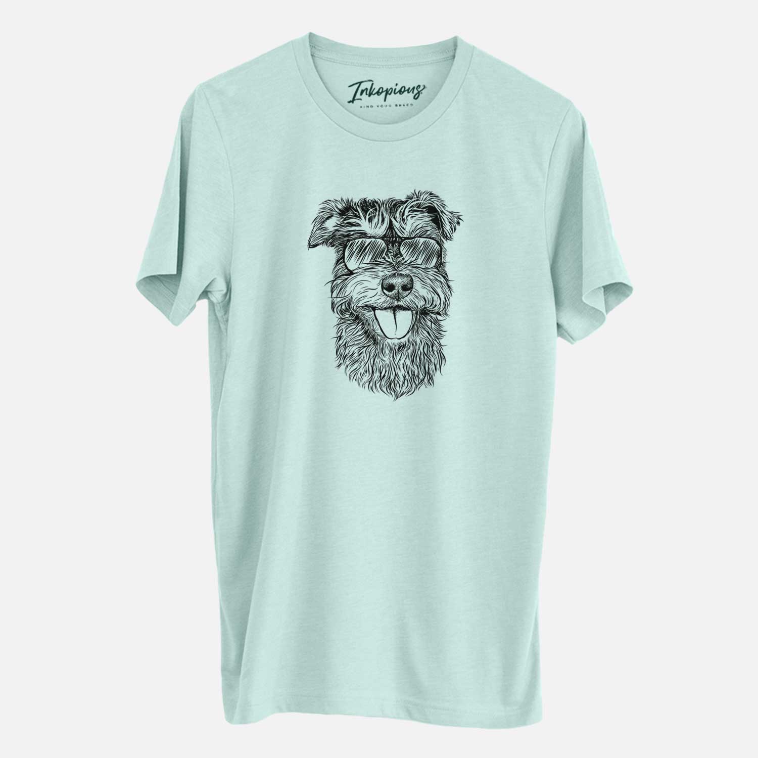 Hand-drawn sketch of Buster the Schnoodle wearing aviator sunglasses on a Heather Sage Unisex crewneck