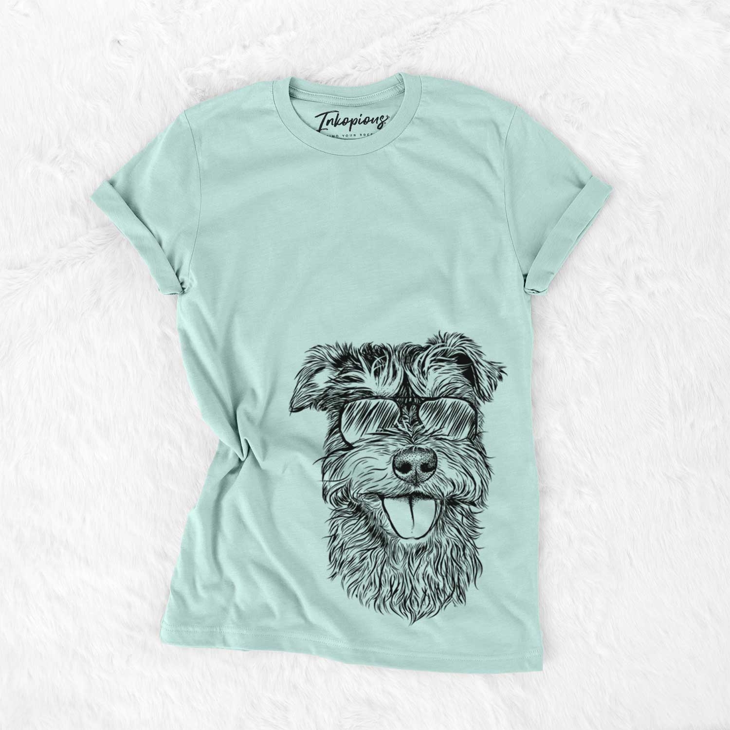 Hand-drawn sketch of Buster the Schnoodle wearing aviator sunglasses on a Heather Sage Unisex crewneck