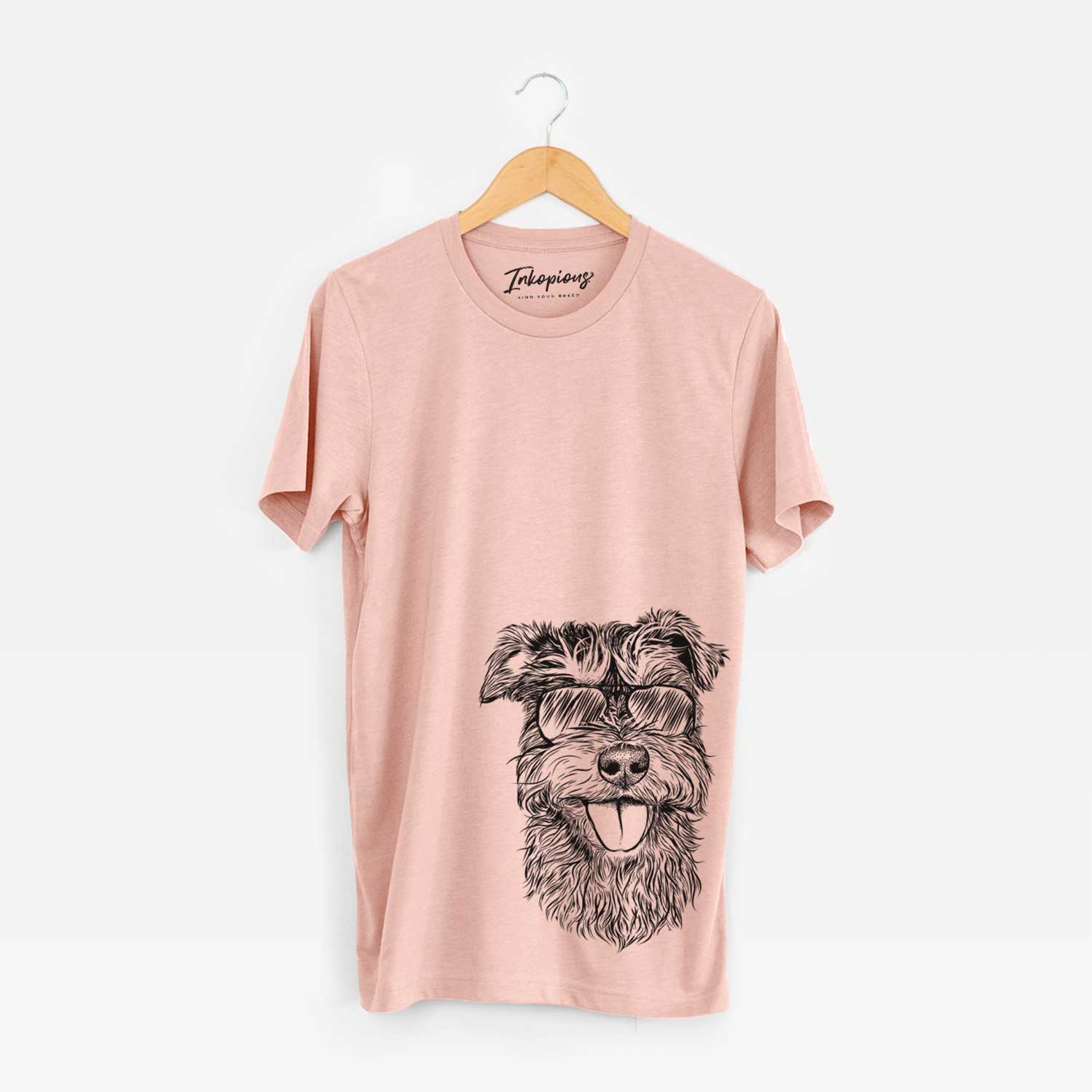 Hand-drawn sketch of Buster the Schnoodle wearing aviator sunglasses on a Peach Unisex crewneck