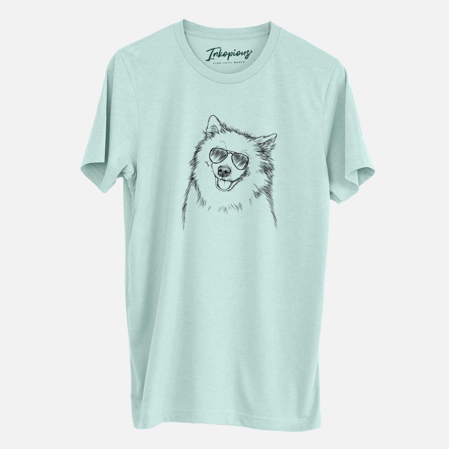 Hand-drawn sketch of Caico the Samoyed wearing aviator sunglasses on a Heather Sage Unisex crewneck