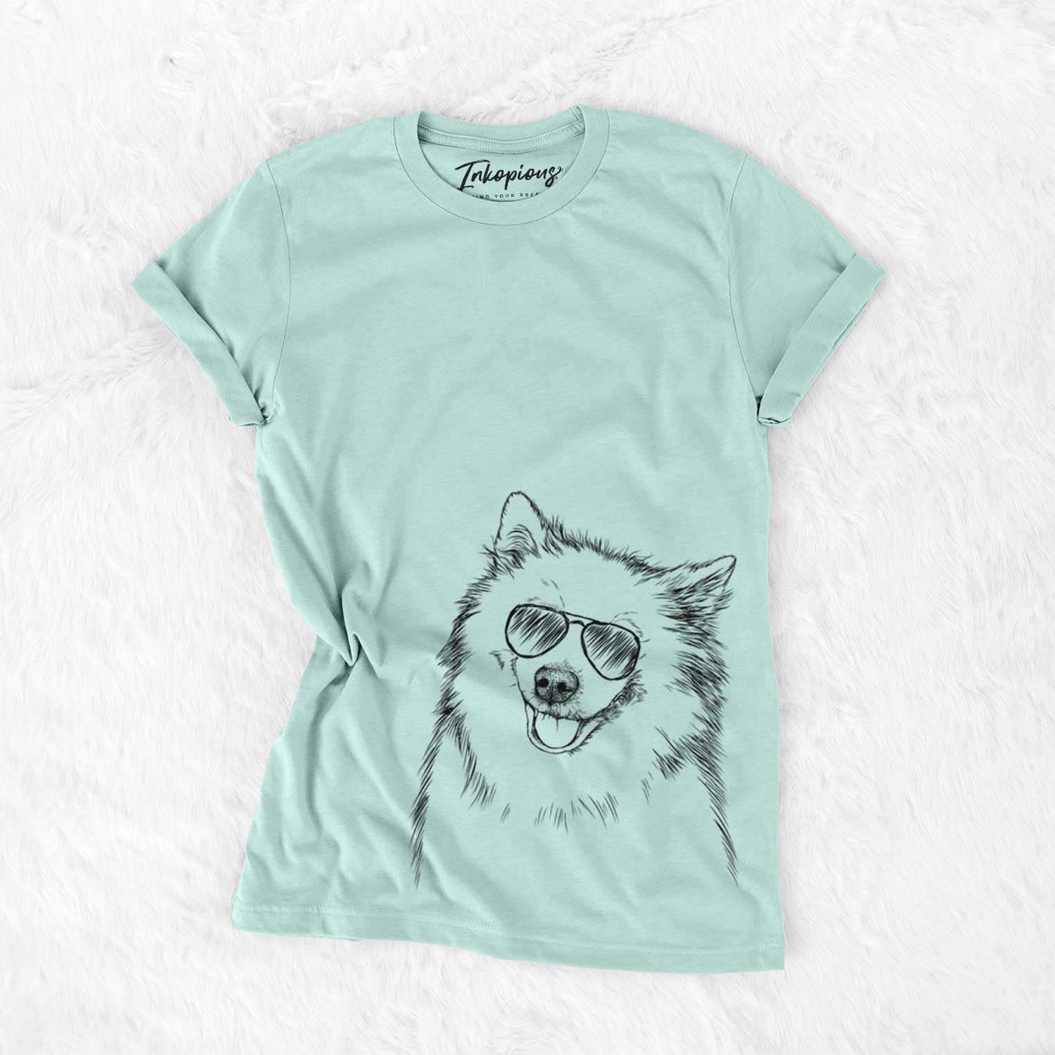 Hand-drawn sketch of Caico the Samoyed wearing aviator sunglasses on a Heather Sage Unisex crewneck