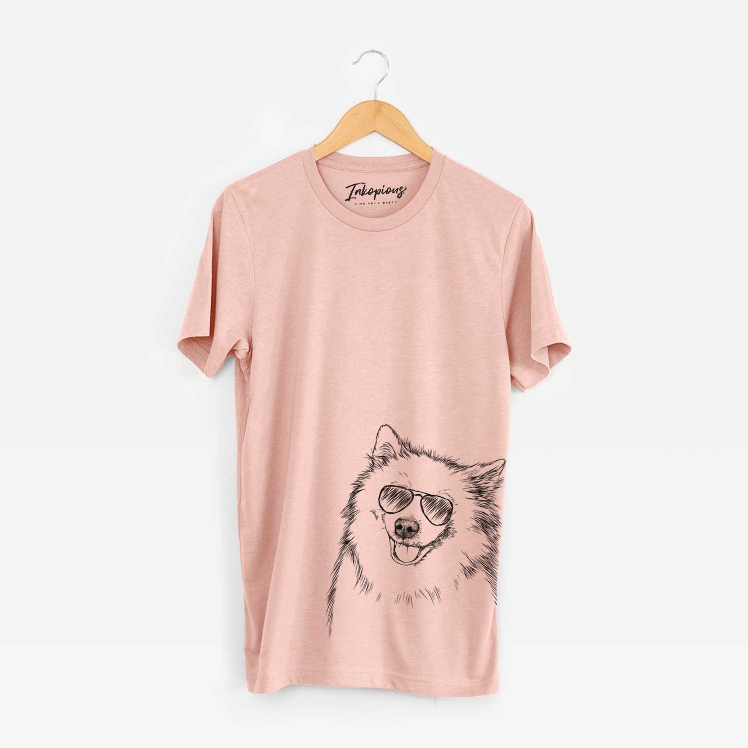 Hand-drawn sketch of Caico the Samoyed wearing aviator sunglasses on a Peach Unisex crewneck