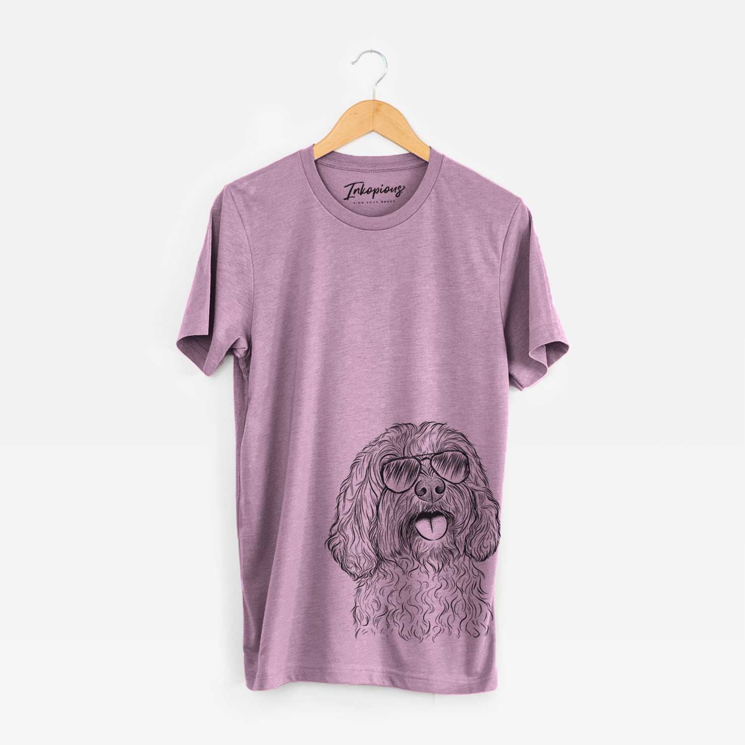 Hand-drawn sketch of Cali the Cavapoo wearing aviator sunglasses on an Orchid Bella Canvas Unisex Crewneck