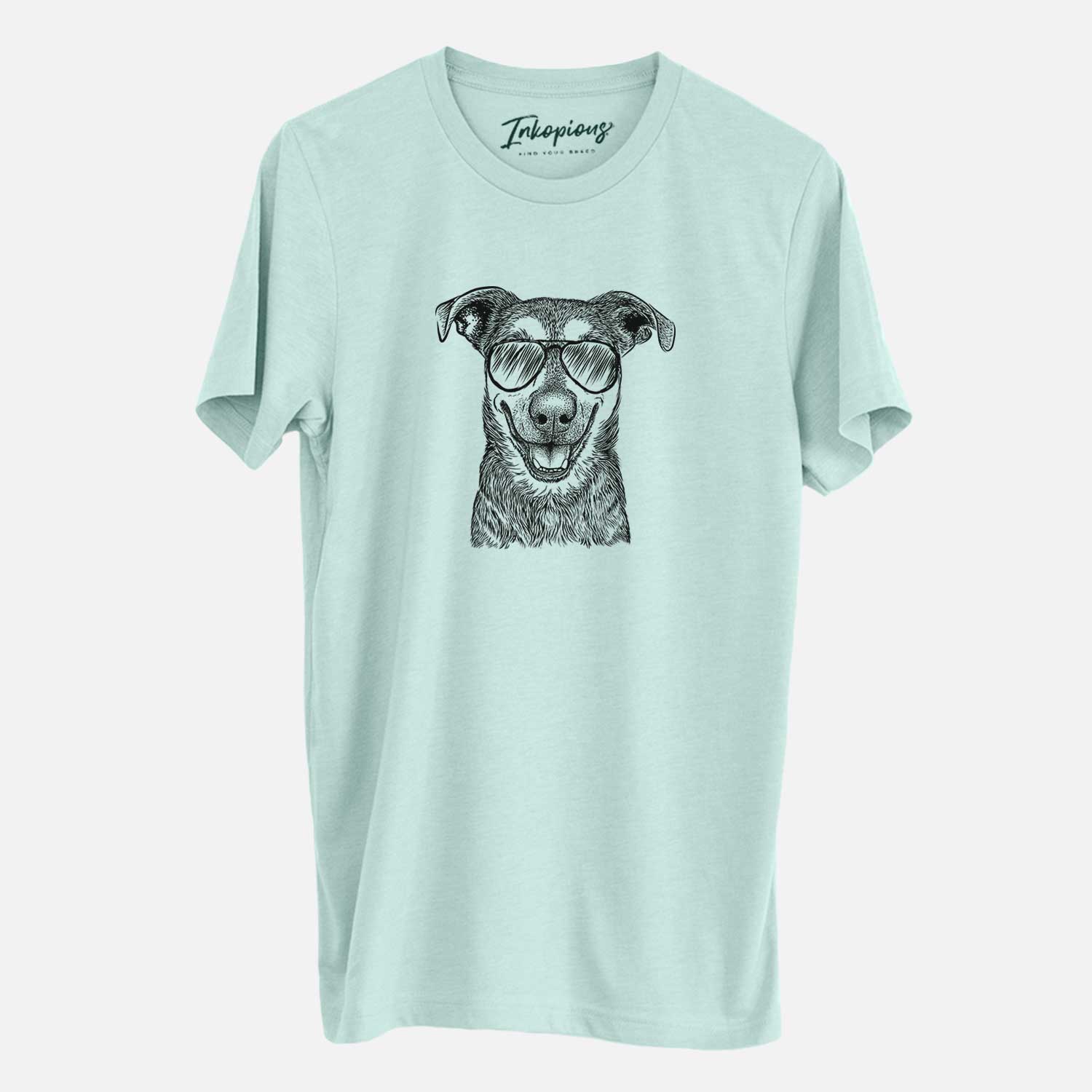 Hand-drawn sketch of Case the Mixed Breed wearing aviator sunglasses on a Heather Sage Unisex crewneck