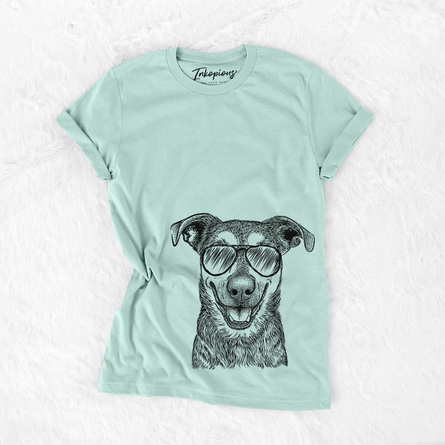 Hand-drawn sketch of Case the Mixed Breed wearing aviator sunglasses on a Heather Sage Unisex crewneck