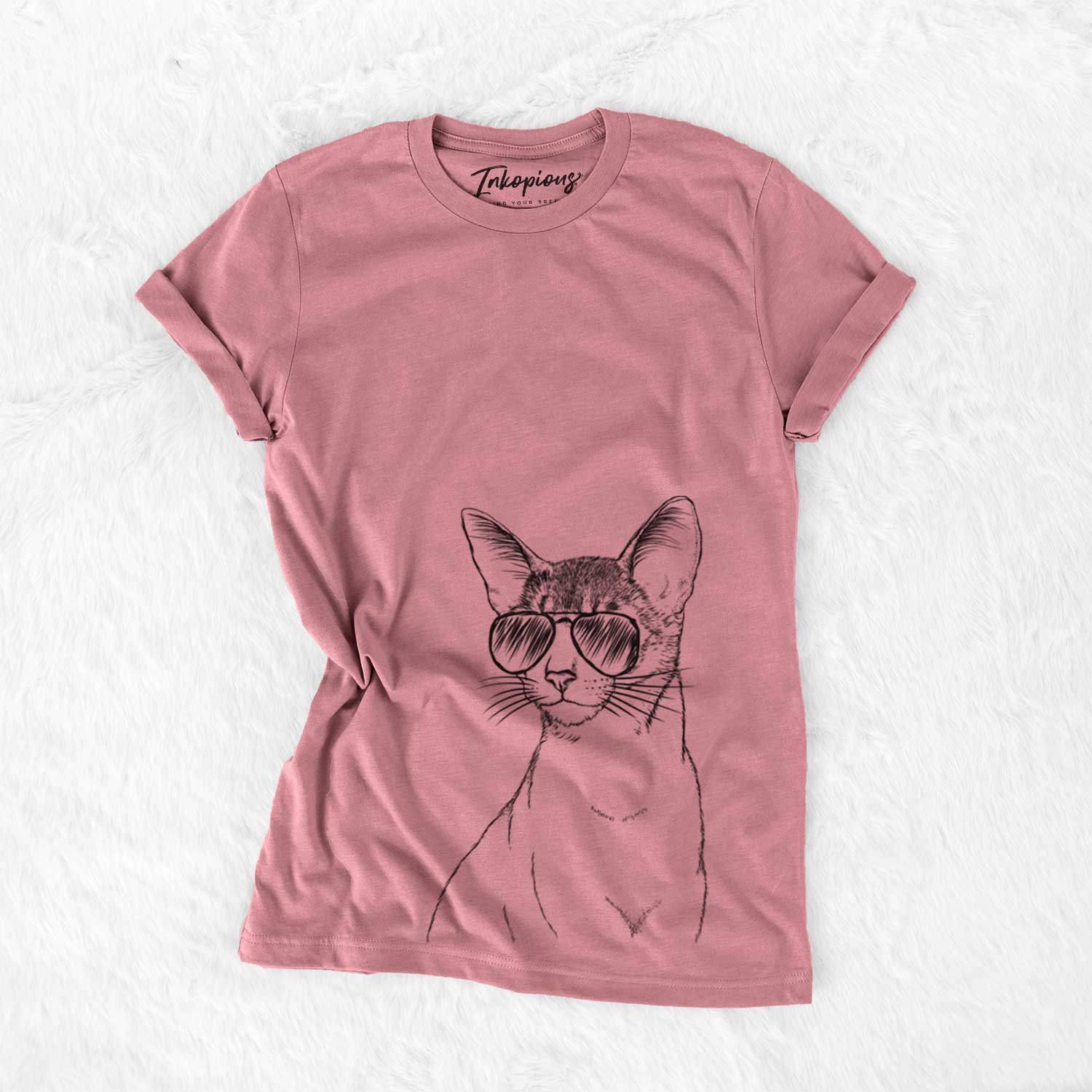 Hand-drawn sketch of Cedric the Abyssinian Cat wearing aviator sunglasses on a Mauve Unisex crewneck